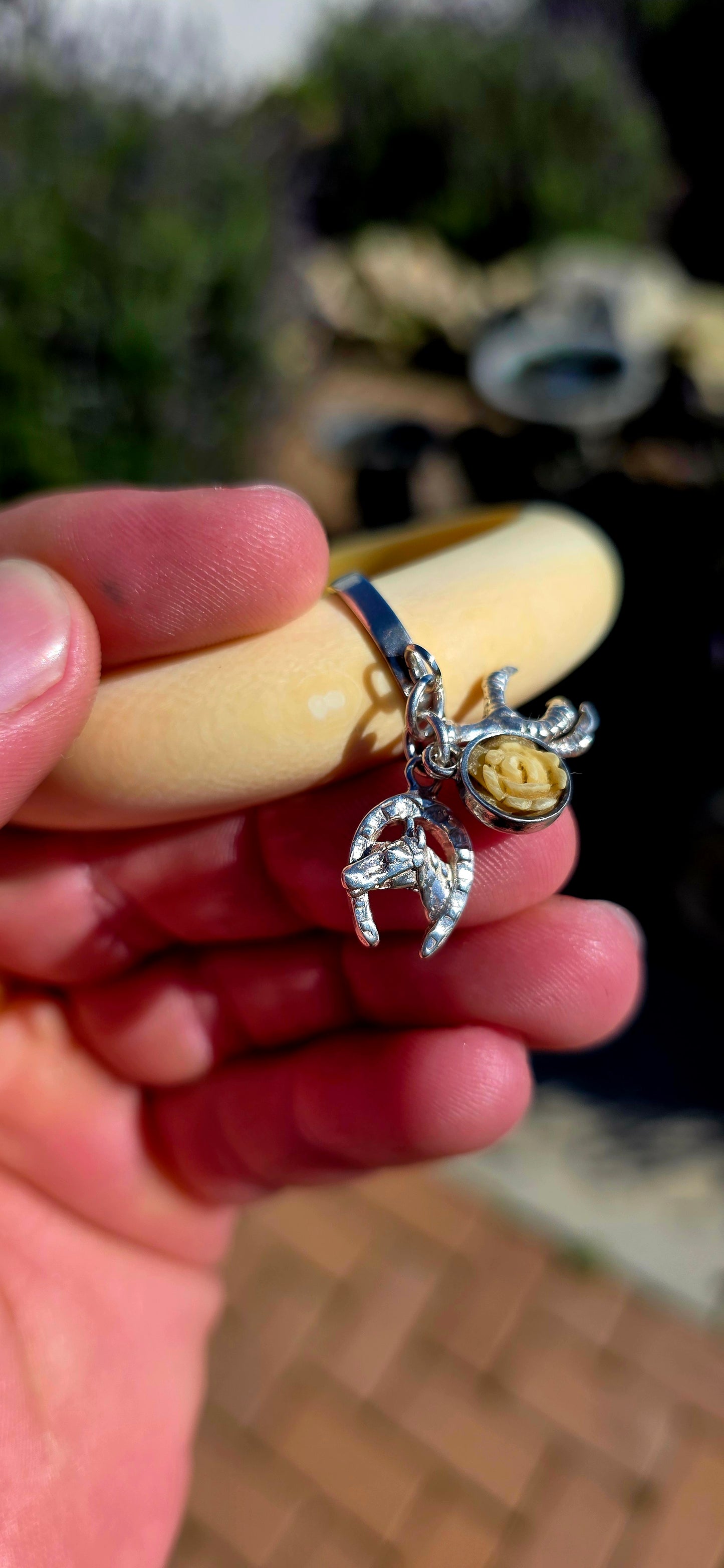 Wonderfully unique, beautifully symbolic, and rich in vintage character... this vintage pre-ban ivory bangle is a delightful piece of wearable history, bringing together craftsmanship with meaningful lucky charms.