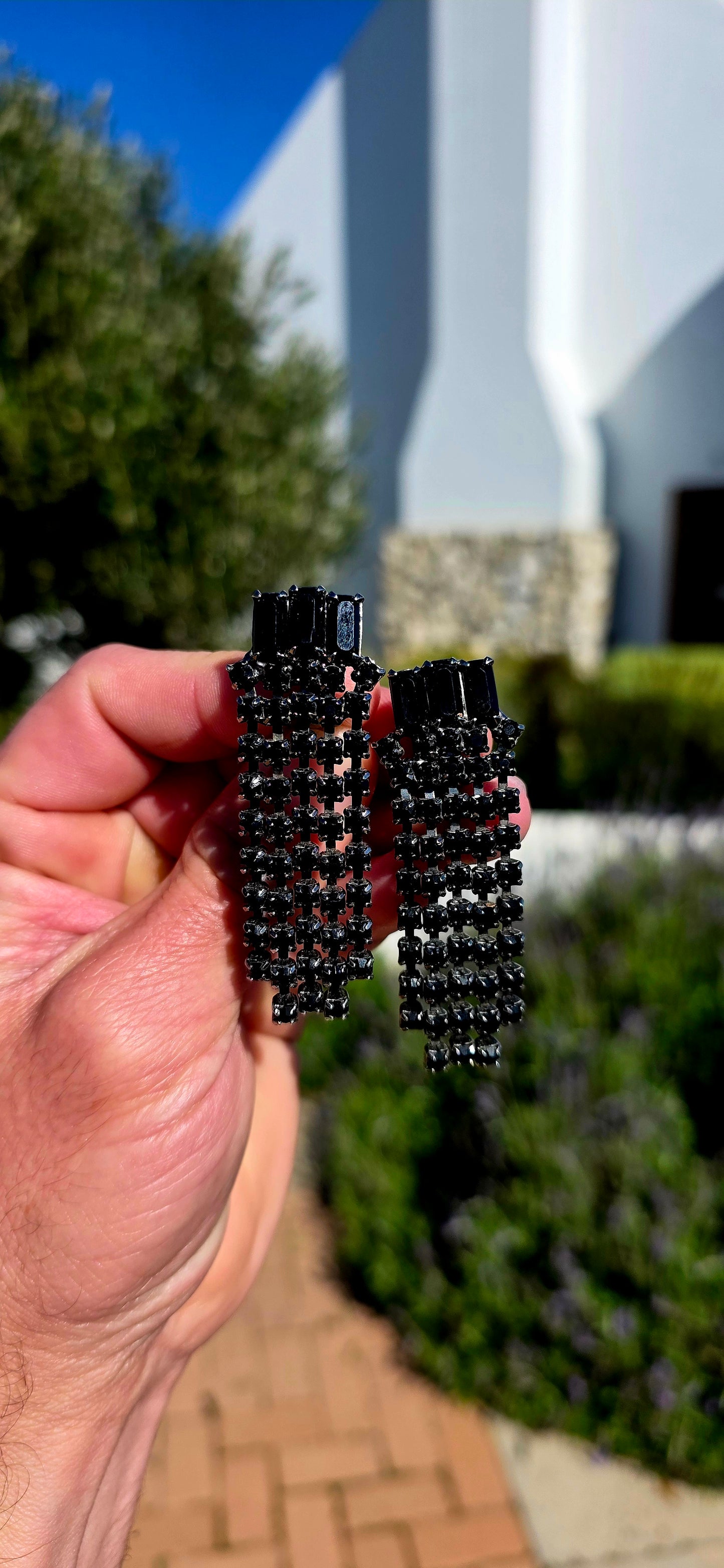 Dramatic, glamorous and wonderfully elegant... this striking pair of vintage Art Deco Revival waterfall clip-on earrings captures the sophistication of the Jazz Age with a bold monochromatic twist.