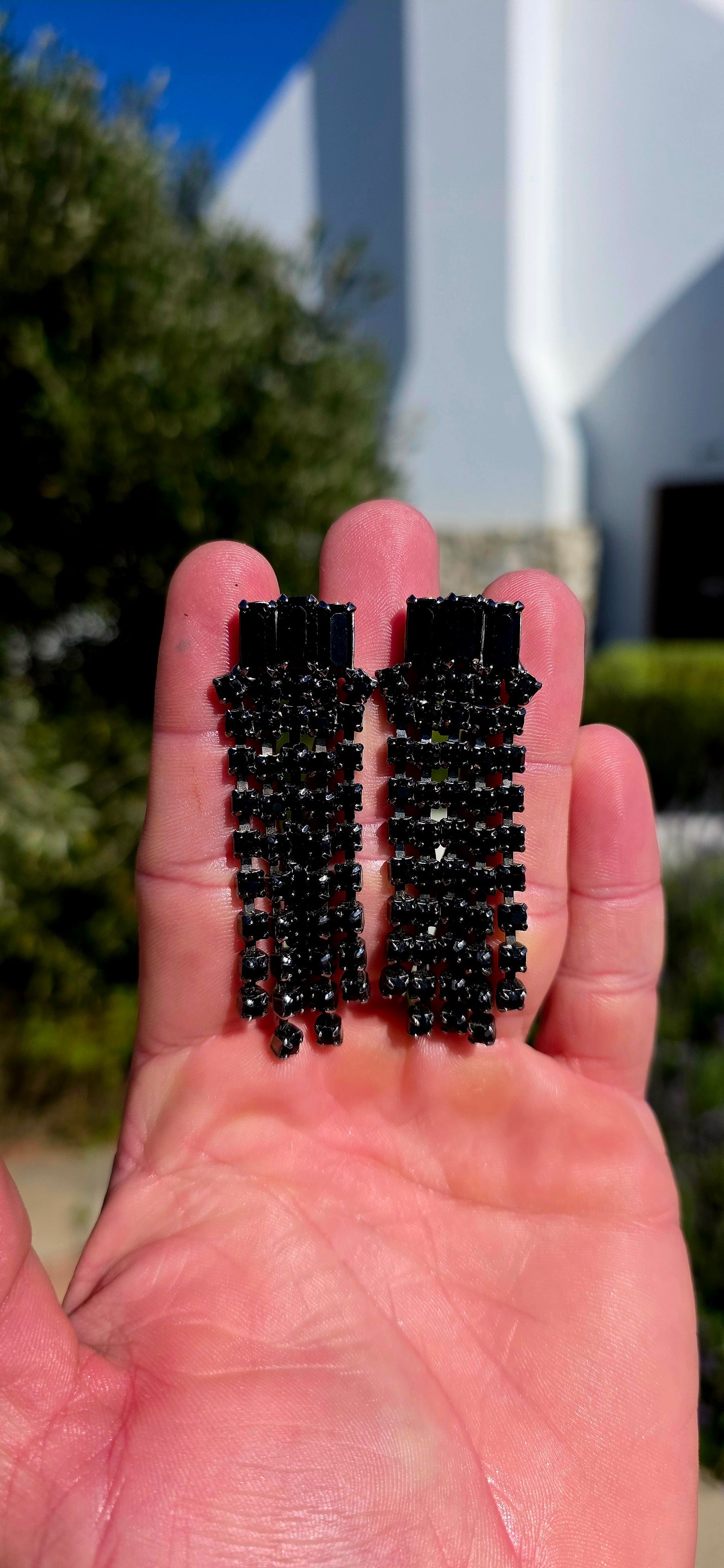 Dramatic, glamorous and wonderfully elegant... this striking pair of vintage Art Deco Revival waterfall clip-on earrings captures the sophistication of the Jazz Age with a bold monochromatic twist.