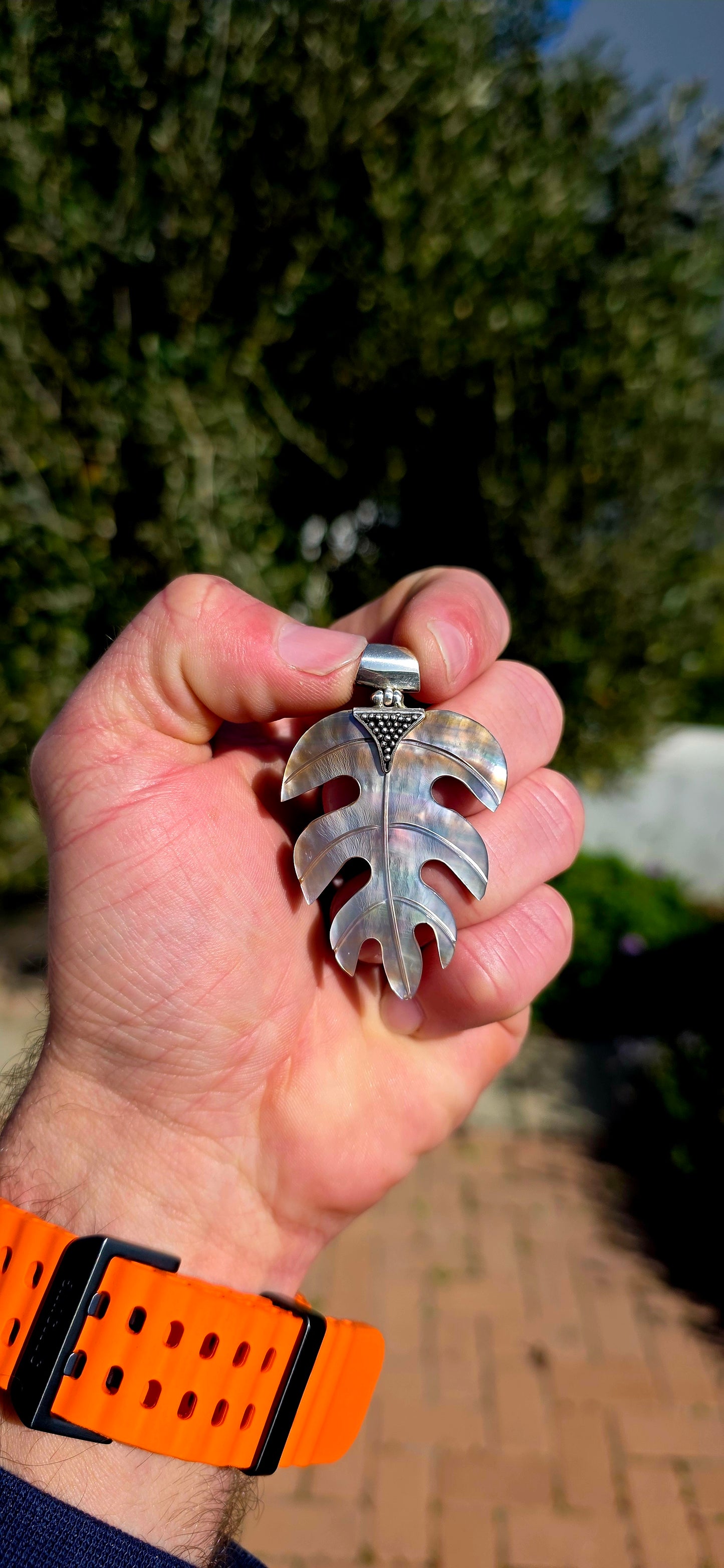 Nature has long inspired some of the world's most beautiful jewellery, and this generously sized hand-carved Mother of Pearl pendant is a perfect example.