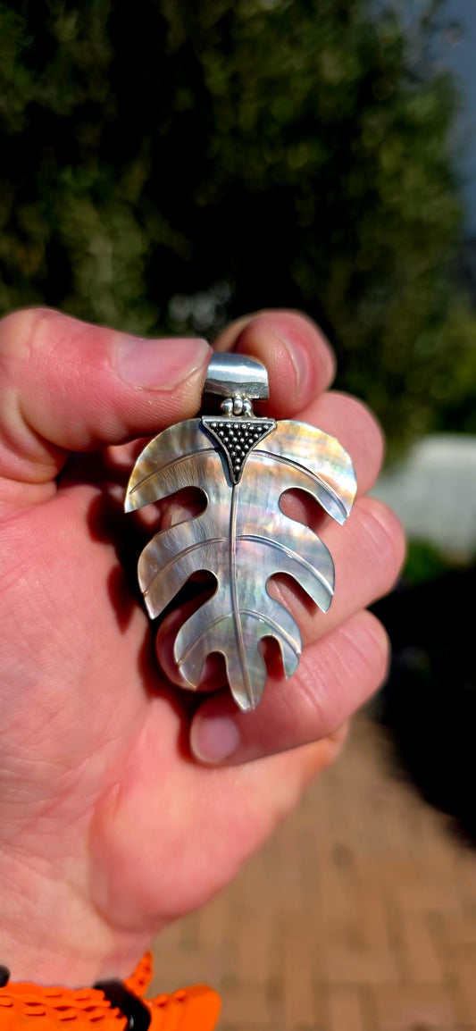 Nature has long inspired some of the world's most beautiful jewellery, and this generously sized hand-carved Mother of Pearl pendant is a perfect example.