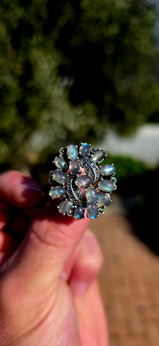 This breathtaking sterling silver statement ring is a celebration of nature's most magical gemstone — spectacular labradorite!