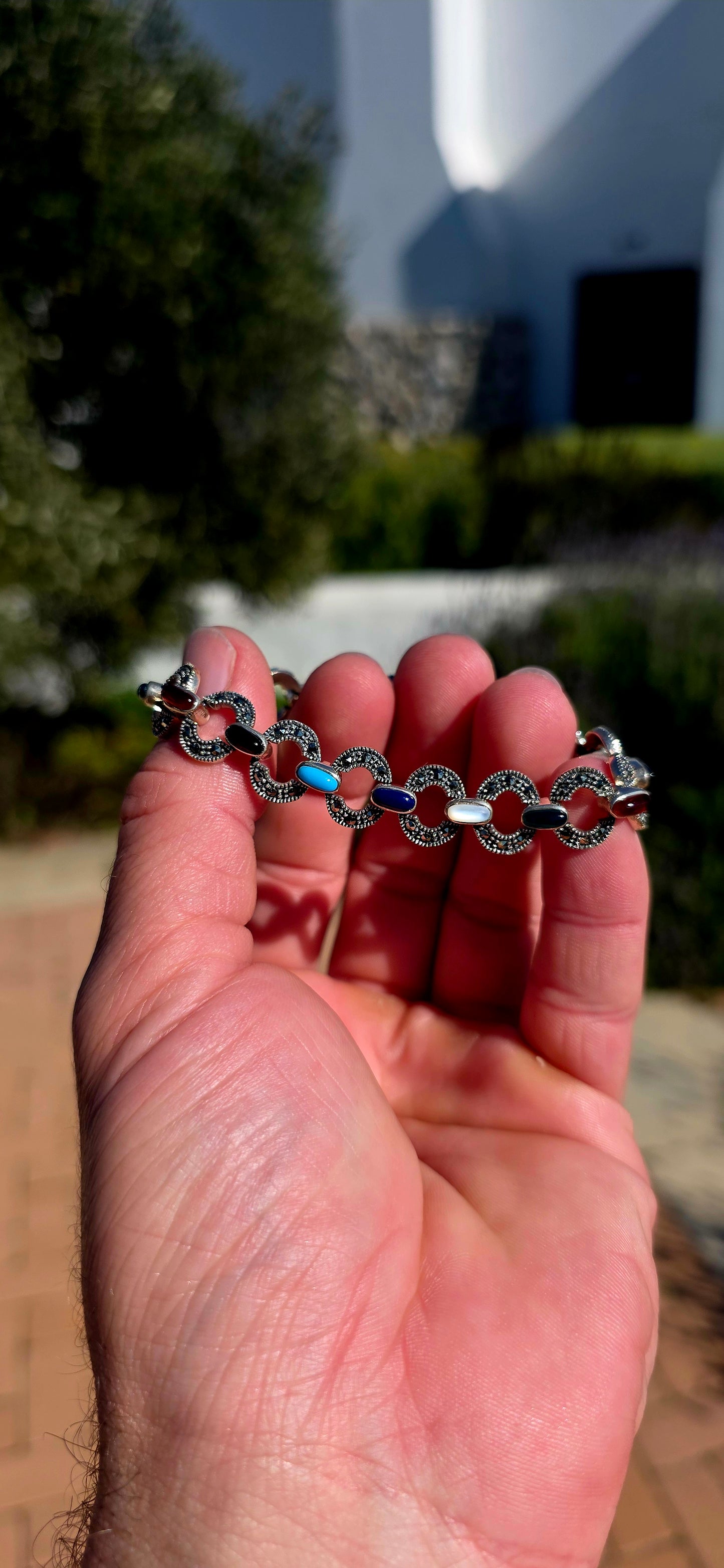 Colourful, sophisticated, and wonderfully nostalgic... this beautiful sterling silver Art Deco Revival bracelet celebrates one of the most iconic jewellery styles of the 1920s.