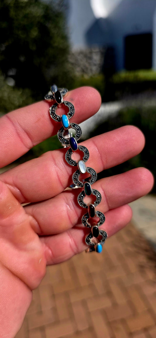 Colourful, sophisticated, and wonderfully nostalgic... this beautiful sterling silver Art Deco Revival bracelet celebrates one of the most iconic jewellery styles of the 1920s.