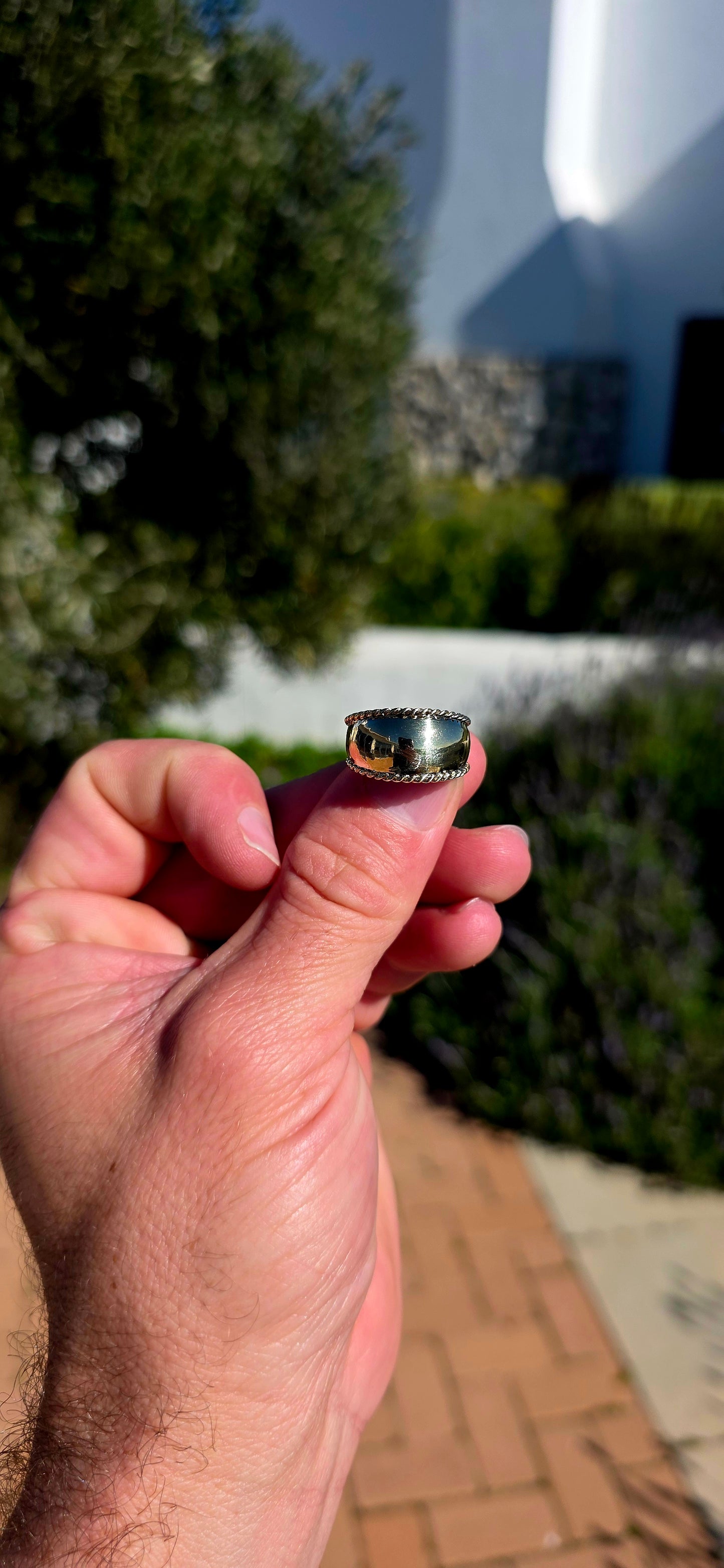 There is something undeniably sophisticated about a beautifully crafted gold band... and this solid 9ct yellow gold statement ring is the perfect example.