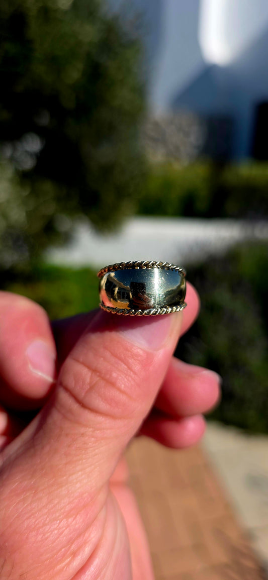 There is something undeniably sophisticated about a beautifully crafted gold band... and this solid 9ct yellow gold statement ring is the perfect example.