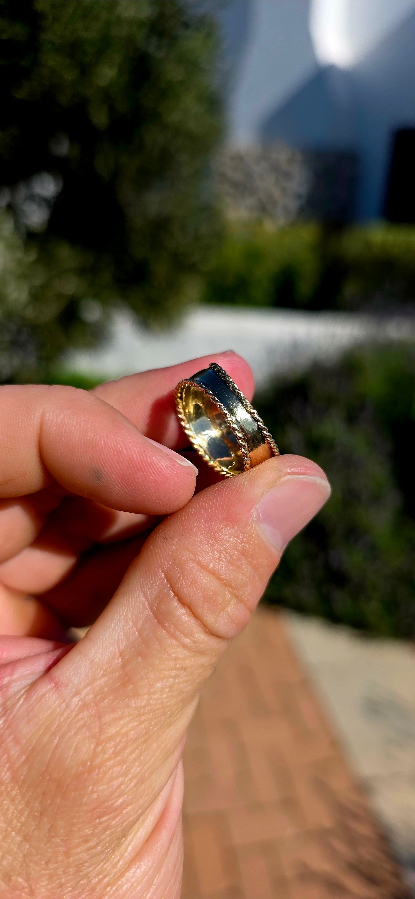 There is something undeniably sophisticated about a beautifully crafted gold band... and this solid 9ct yellow gold statement ring is the perfect example.