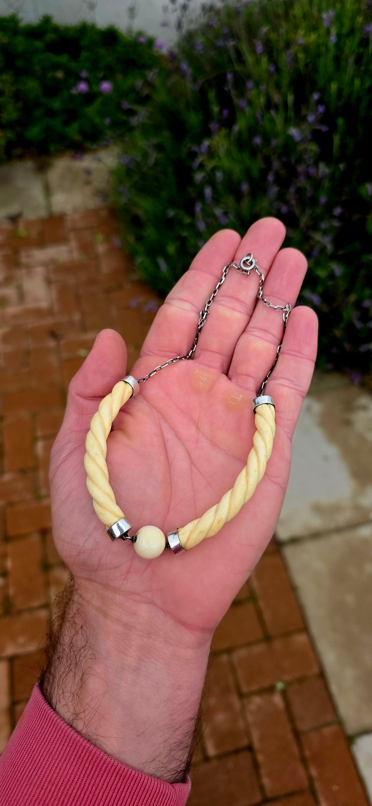 Wonderfully sculptural and effortlessly elegant the necklace combines the warm creamy tones of pre-ban carved ivory with the cool sophistication of sterling silver, creating a piece that feels every bit as stylish today as it did nearly a century ago.