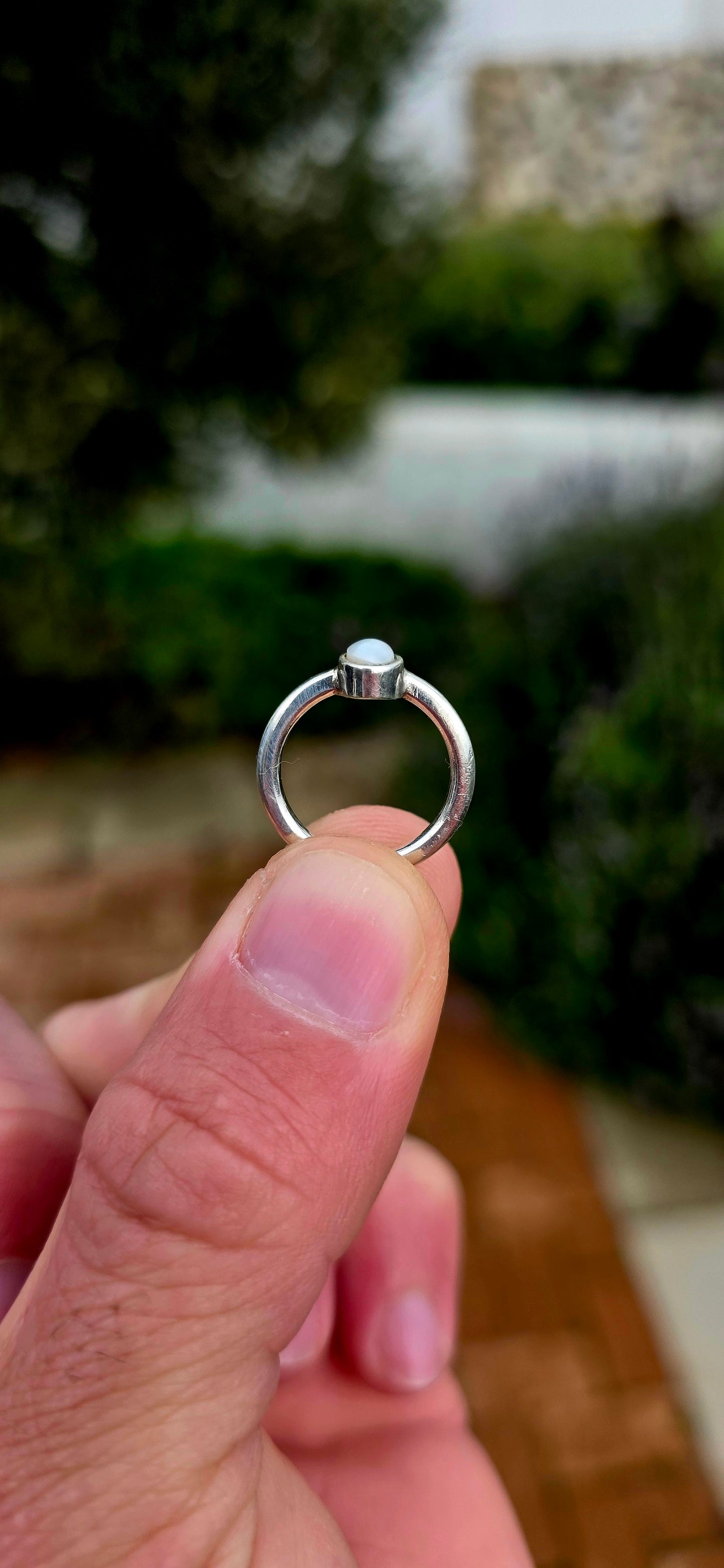 Elegant in its simplicity and timeless in its appeal... this beautifully handmade sterling silver solitaire ring showcases a luminous oval Mabe pearl in the most enchanting soft grey-blue hue.