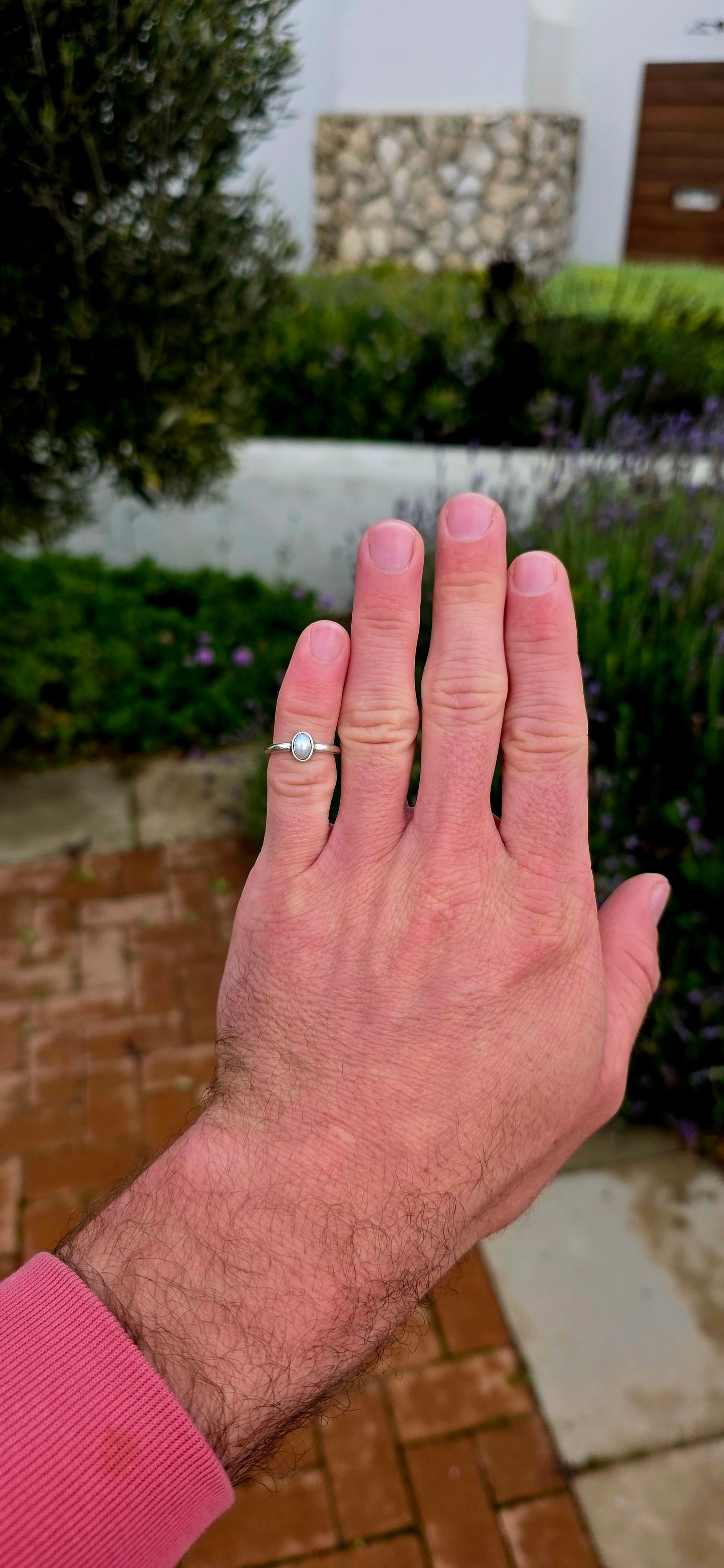 Elegant in its simplicity and timeless in its appeal... this beautifully handmade sterling silver solitaire ring showcases a luminous oval Mabe pearl in the most enchanting soft grey-blue hue.