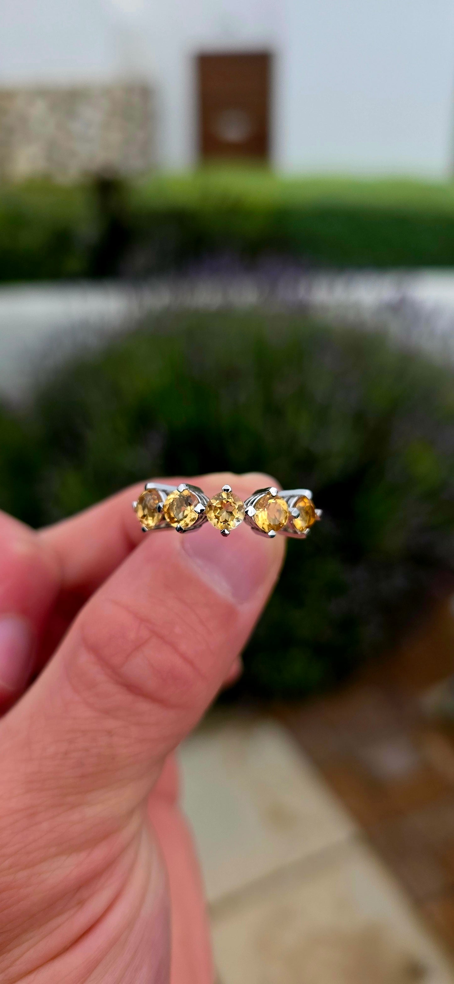 Bright, elegant and wonderfully easy to wear... this beautiful sterling silver half eternity ring features a glowing row of five natural citrine gemstones, bringing the most gorgeous little burst of golden sunshine to the finger.
