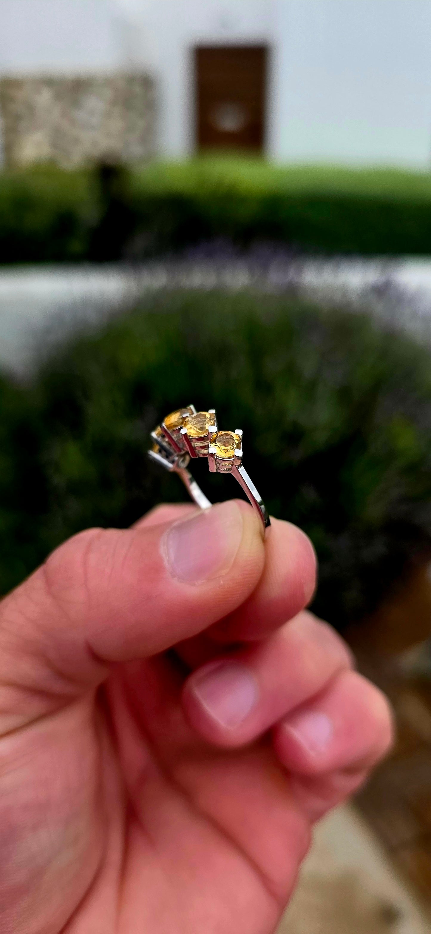 Bright, elegant and wonderfully easy to wear... this beautiful sterling silver half eternity ring features a glowing row of five natural citrine gemstones, bringing the most gorgeous little burst of golden sunshine to the finger.