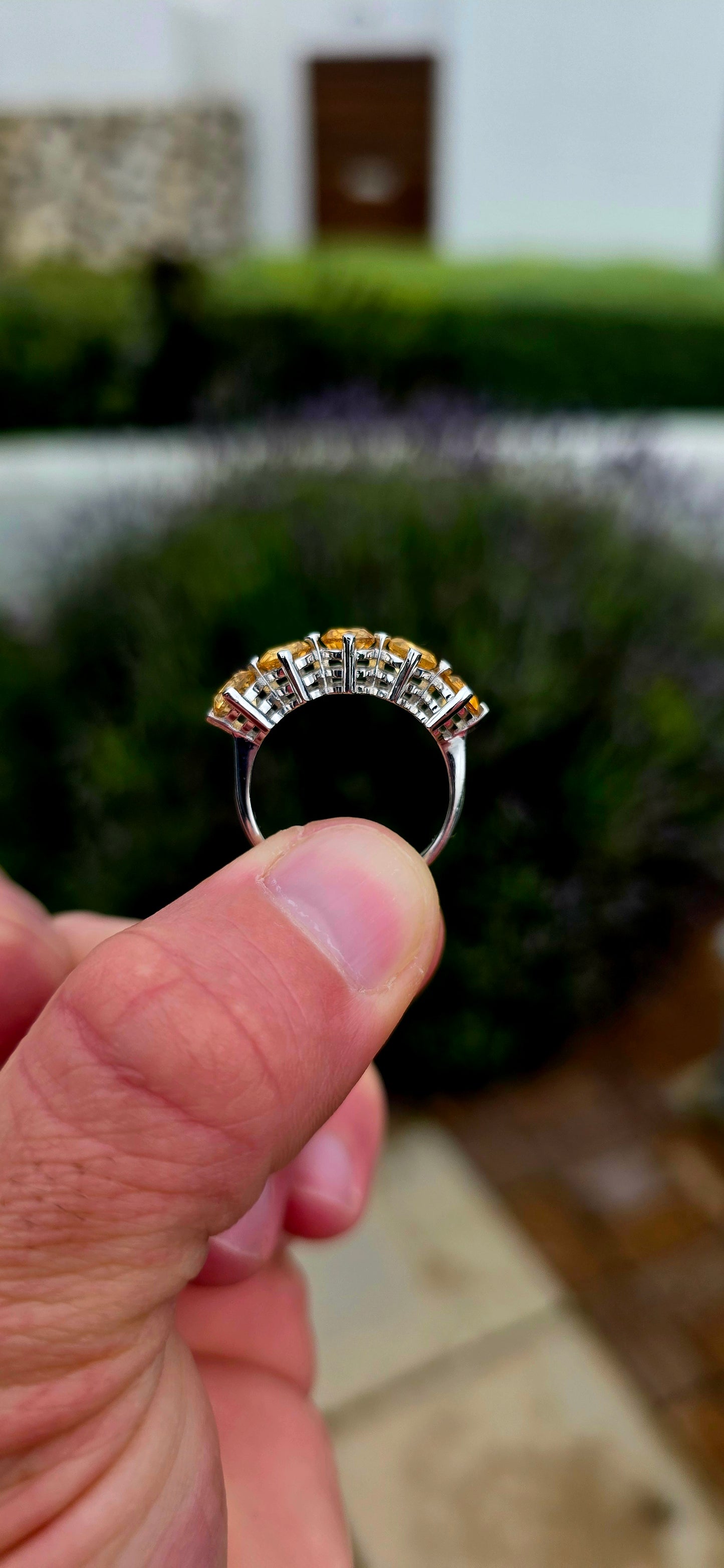 Bright, elegant and wonderfully easy to wear... this beautiful sterling silver half eternity ring features a glowing row of five natural citrine gemstones, bringing the most gorgeous little burst of golden sunshine to the finger.
