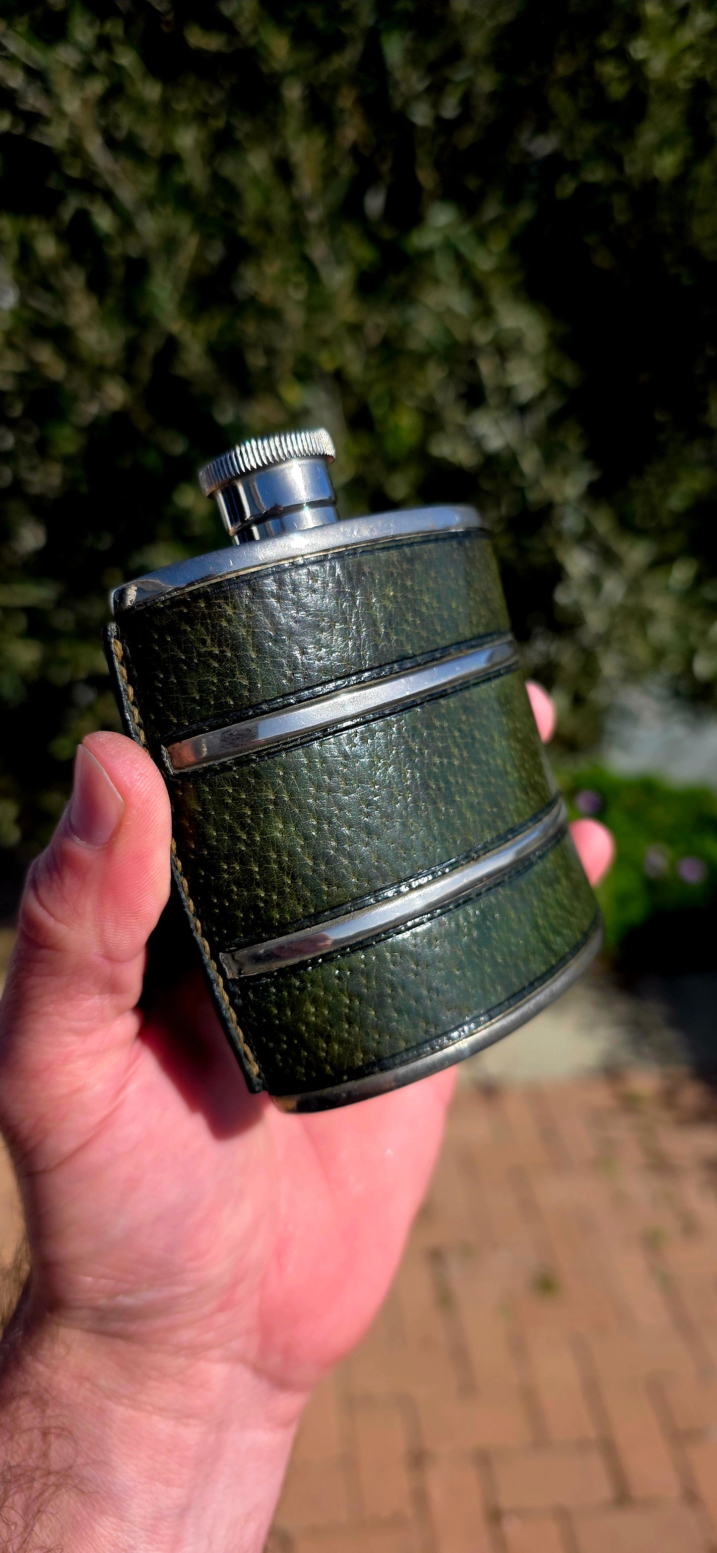 Now THIS is old-school cool.A fabulous vintage 1970s Gucci hip flask, beautifully crafted in metal and wrapped in wonderfully aged deep forest-green leather.