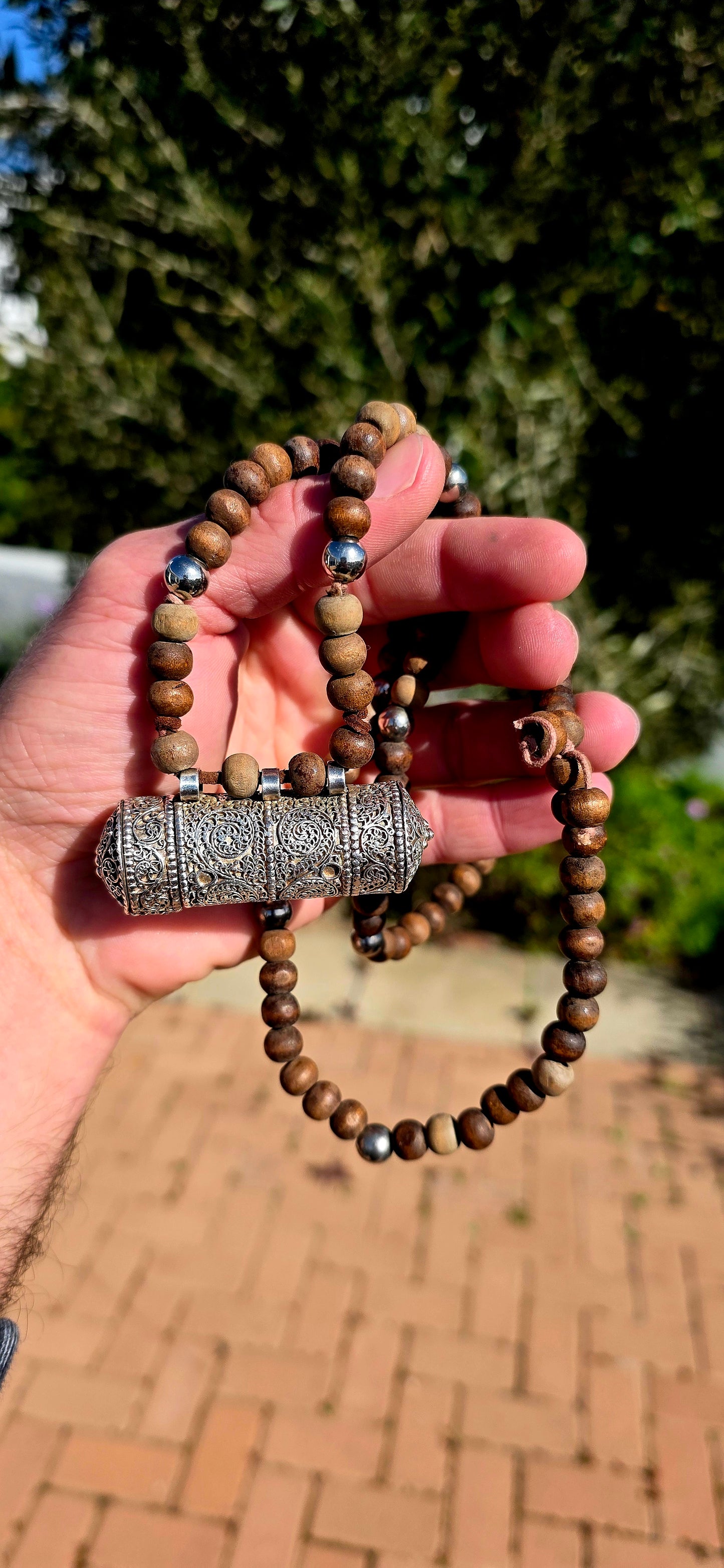 A beautiful Tibetan/Himalayan Buddhist mala-style necklace centred by an ornate sterling silver Ga'u (Ghau) prayer-box amulet.