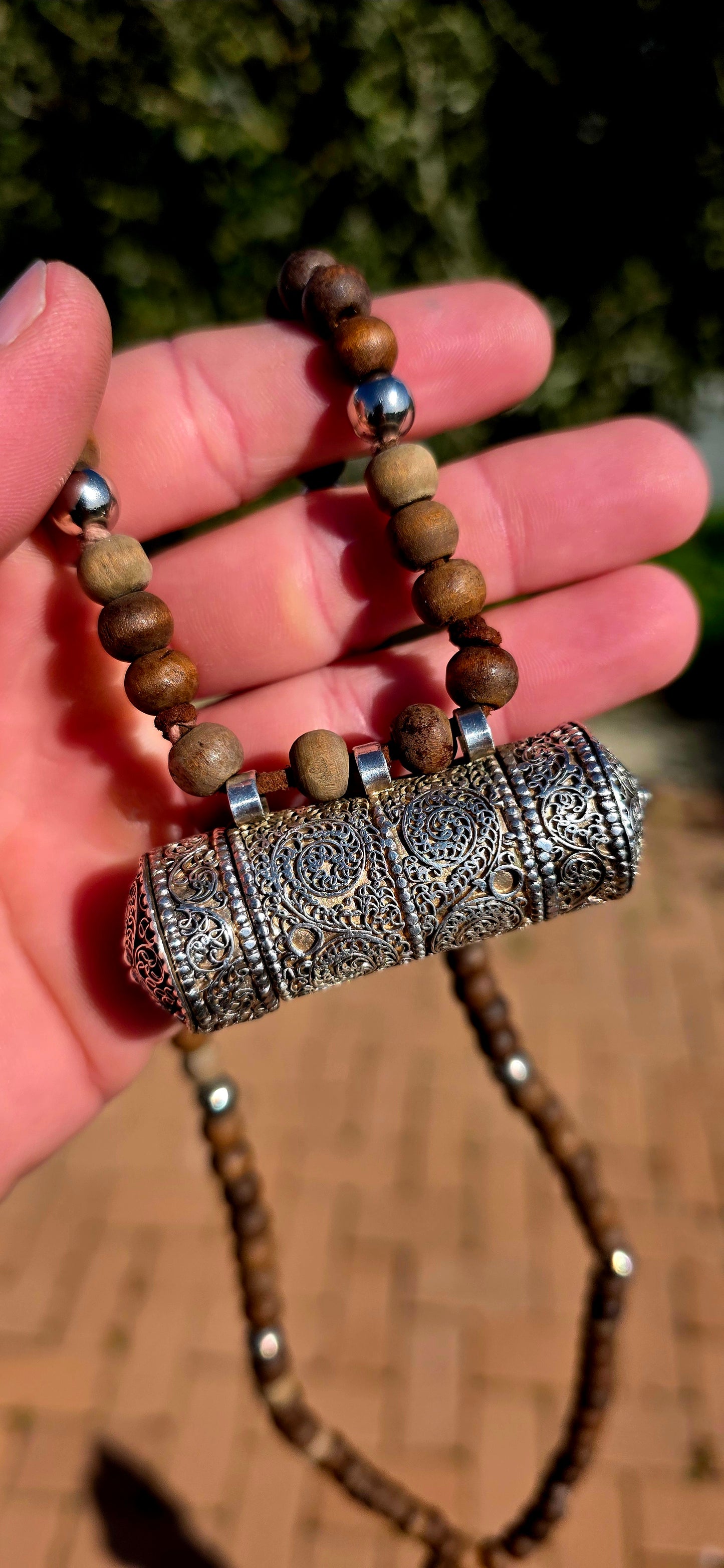 A beautiful Tibetan/Himalayan Buddhist mala-style necklace centred by an ornate sterling silver Ga'u (Ghau) prayer-box amulet.