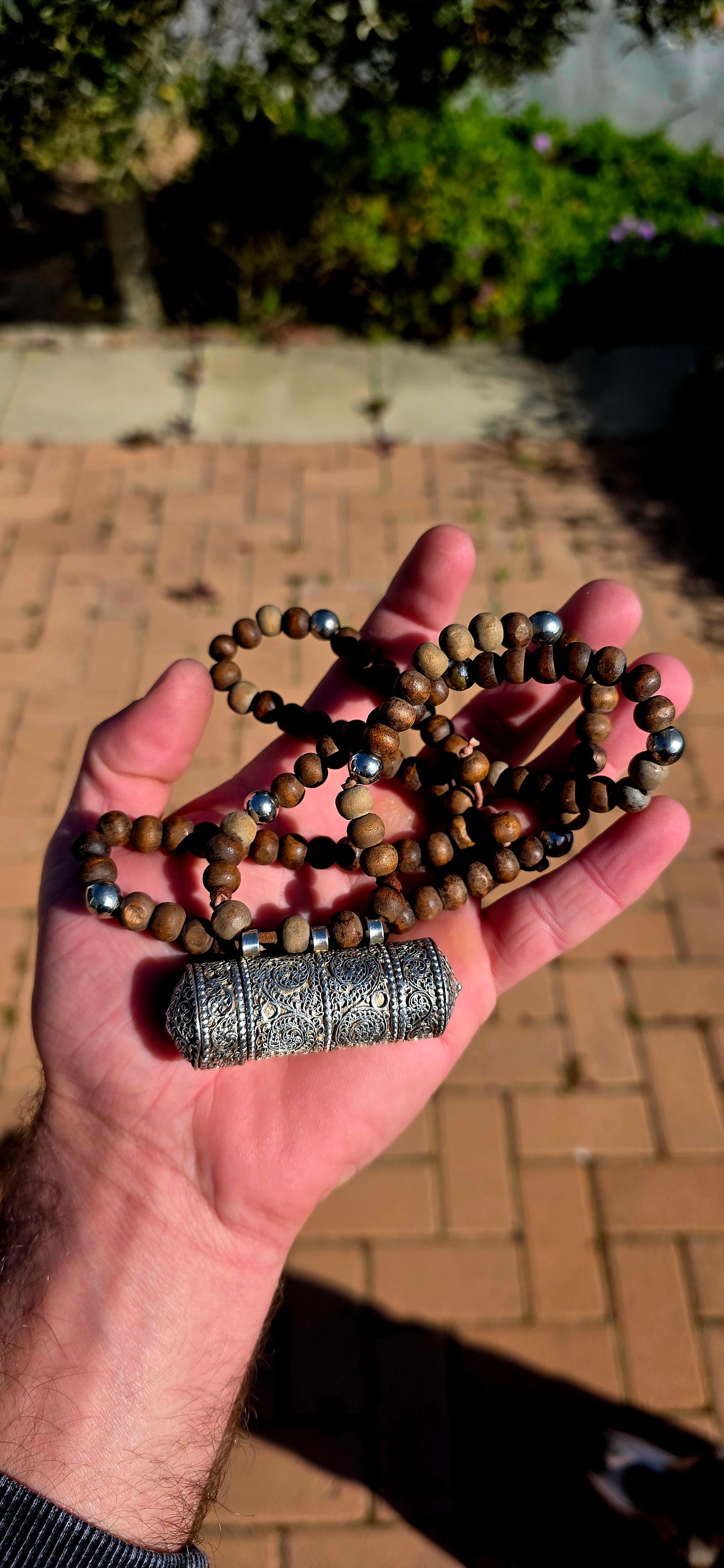 A beautiful Tibetan/Himalayan Buddhist mala-style necklace centred by an ornate sterling silver Ga'u (Ghau) prayer-box amulet.