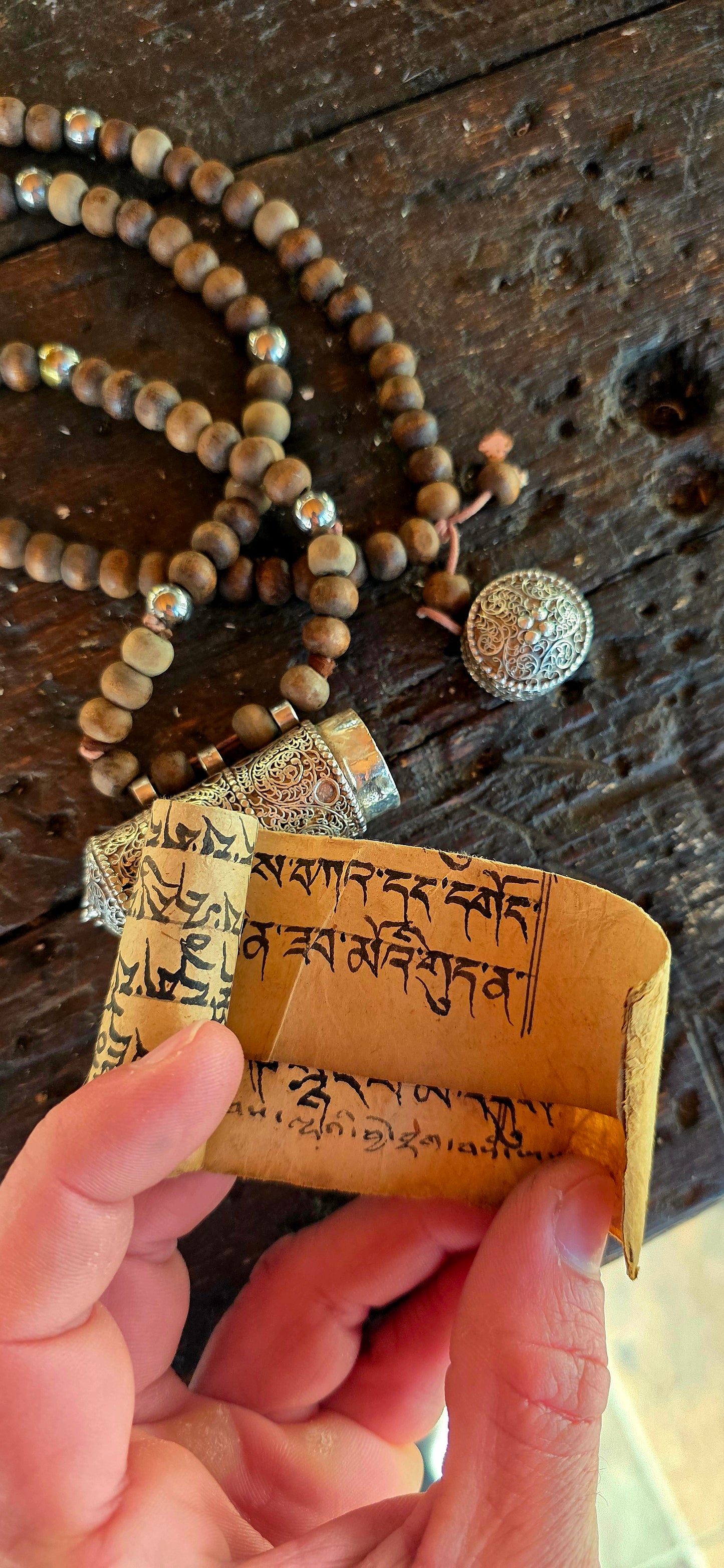 A beautiful Tibetan/Himalayan Buddhist mala-style necklace centred by an ornate sterling silver Ga'u (Ghau) prayer-box amulet.
