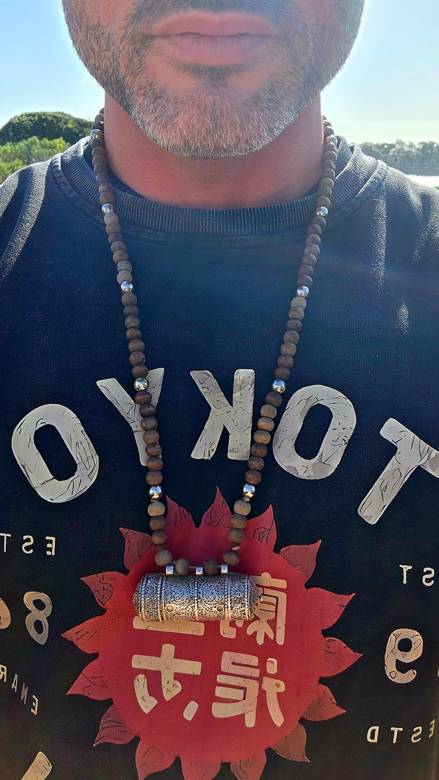 A beautiful Tibetan/Himalayan Buddhist mala-style necklace centred by an ornate sterling silver Ga'u (Ghau) prayer-box amulet.