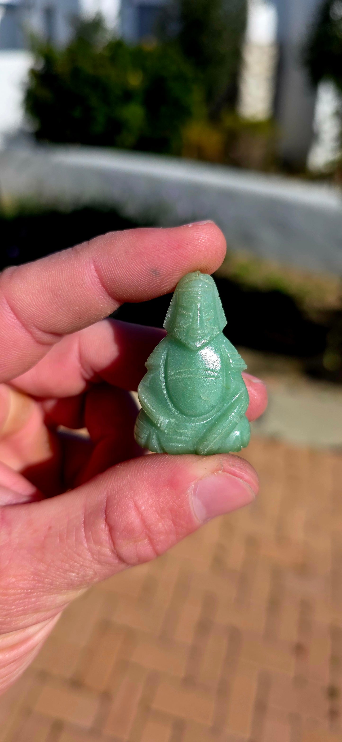 A wonderfully colourful vintage collection of seven miniature Chinese-deity and auspicious figure carvings, each individually hand-carved from a different natural gemstone.