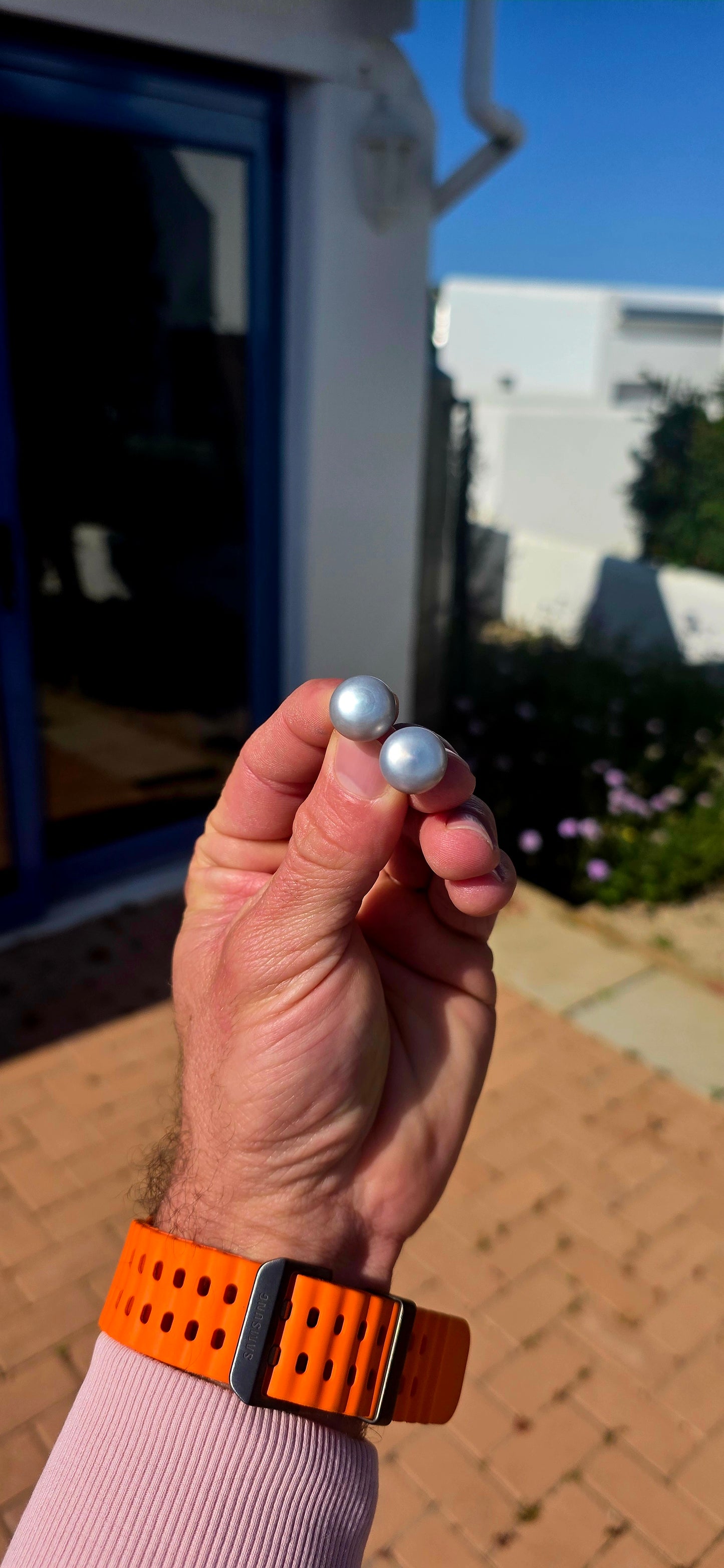 Beautifully classic with a wonderfully modern edge… this generously sized pair of freshwater button pearl stud earrings features gorgeous smoky silvery-grey pearls with a soft natural lustre and subtle flashes of blue-grey as they catch the light.