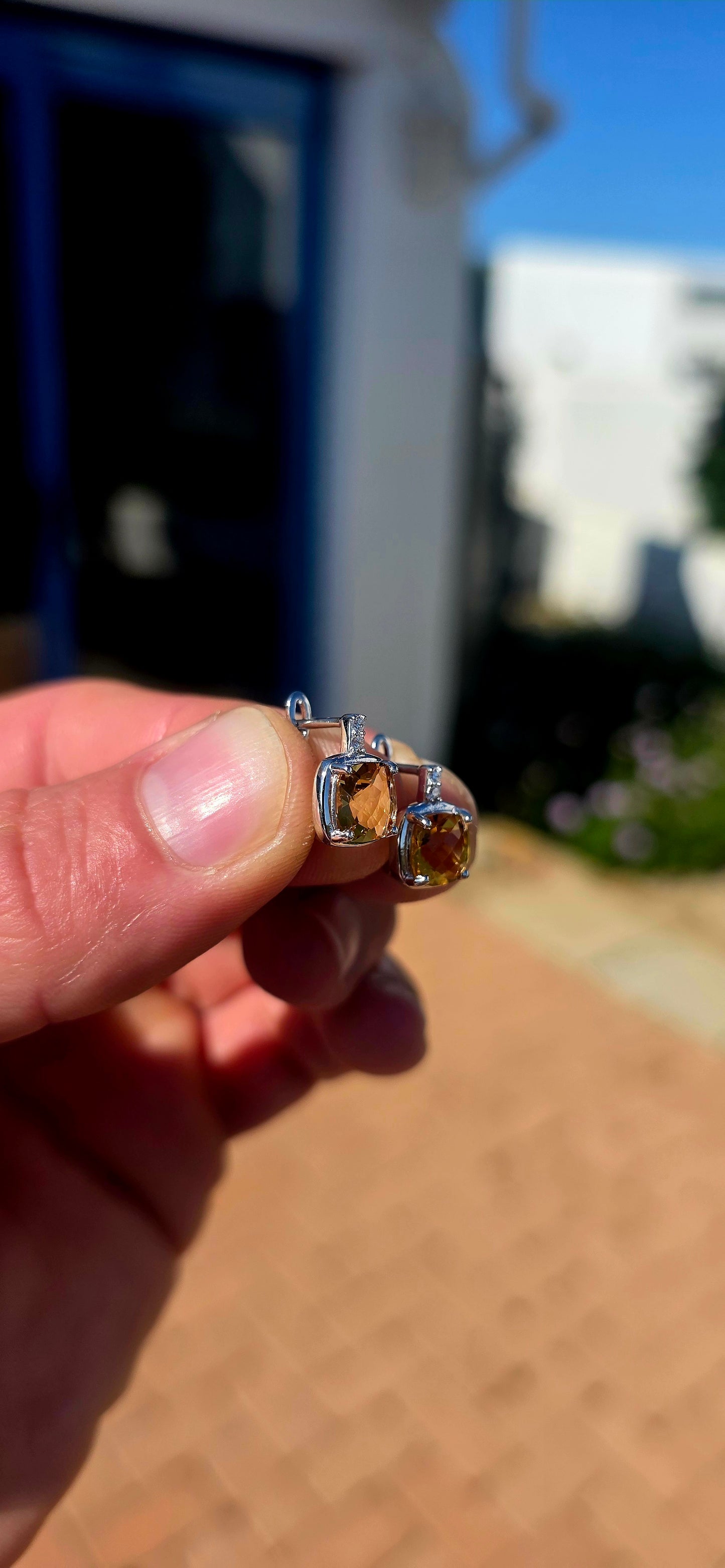 Elegant, classic and filled with the most gorgeous warm colour! These beautiful sterling silver drop earrings each feature a generously sized cushion-cut citrine gemstone, glowing in rich golden honey and champagne tones.