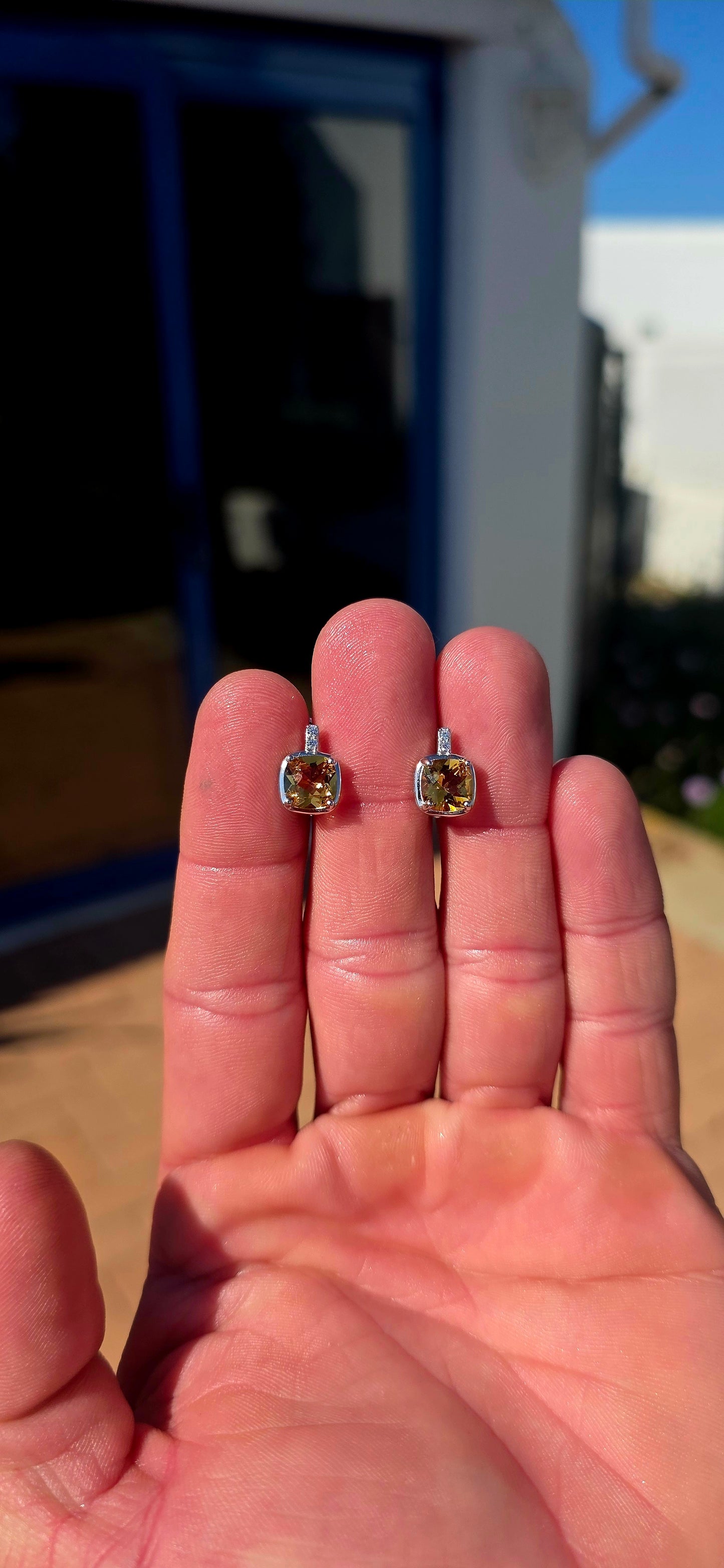 Elegant, classic and filled with the most gorgeous warm colour! These beautiful sterling silver drop earrings each feature a generously sized cushion-cut citrine gemstone, glowing in rich golden honey and champagne tones.