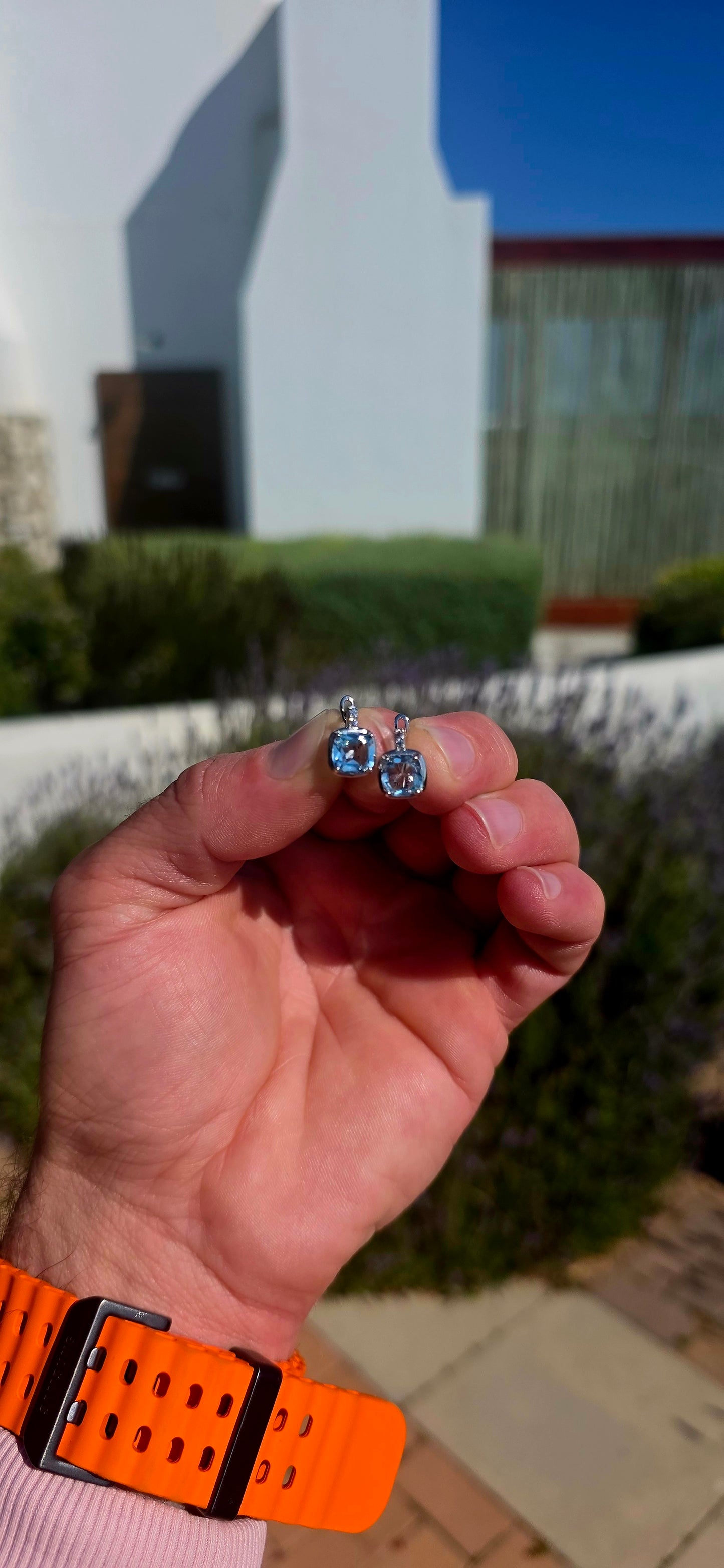 Fresh, elegant and SO beautifully sparkly! These gorgeous sterling silver drop earrings each feature a generously sized cushion-cut sky blue topaz, glowing in the prettiest crystal-clear icy blue.
