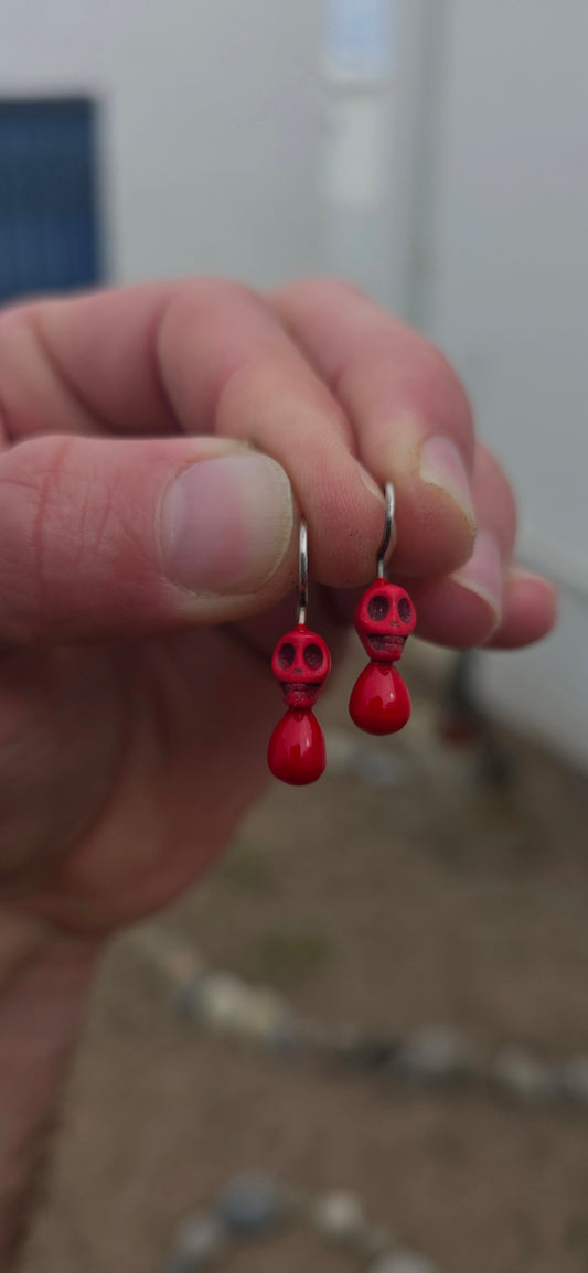 How fabulously quirky are these!! A wonderfully playful pair of contemporary South African designer earrings by Geraldine Fenn, combining a little macabre humour with a gorgeous pop of bright red.