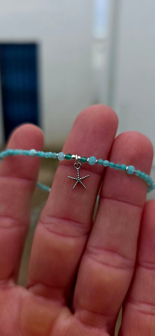 Fine, dainty and absolutely gorgeous! This delicate sterling silver bracelet is strung with tiny faceted blue apatite gemstone beads, their beautiful aqua-blue colouring giving the piece a wonderfully fresh, ocean-inspired feel.