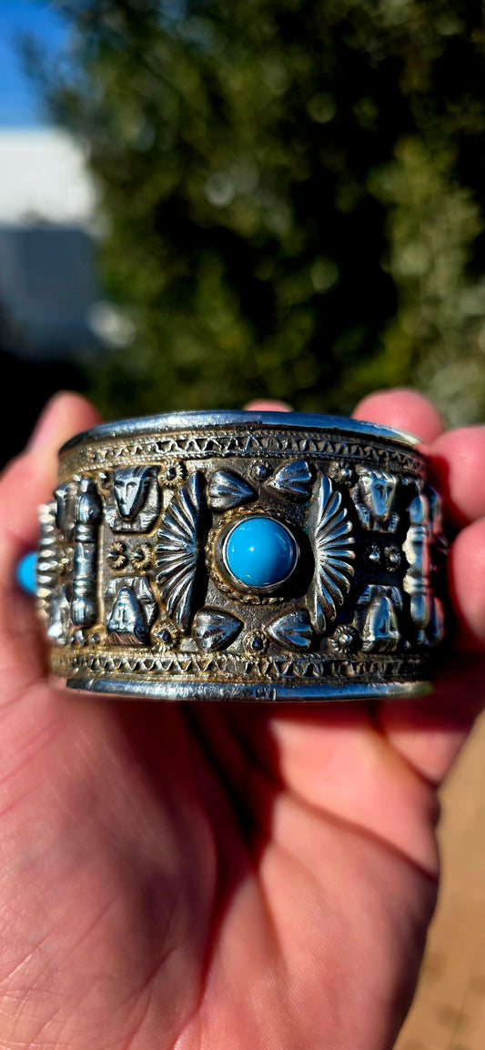 What an absolute statement piece! A wonderfully chunky, extra-wide vintage Egyptian Revival open cuff bangle, crafted in 800 silver and completely covered in fabulous raised Egyptian-inspired decoration.