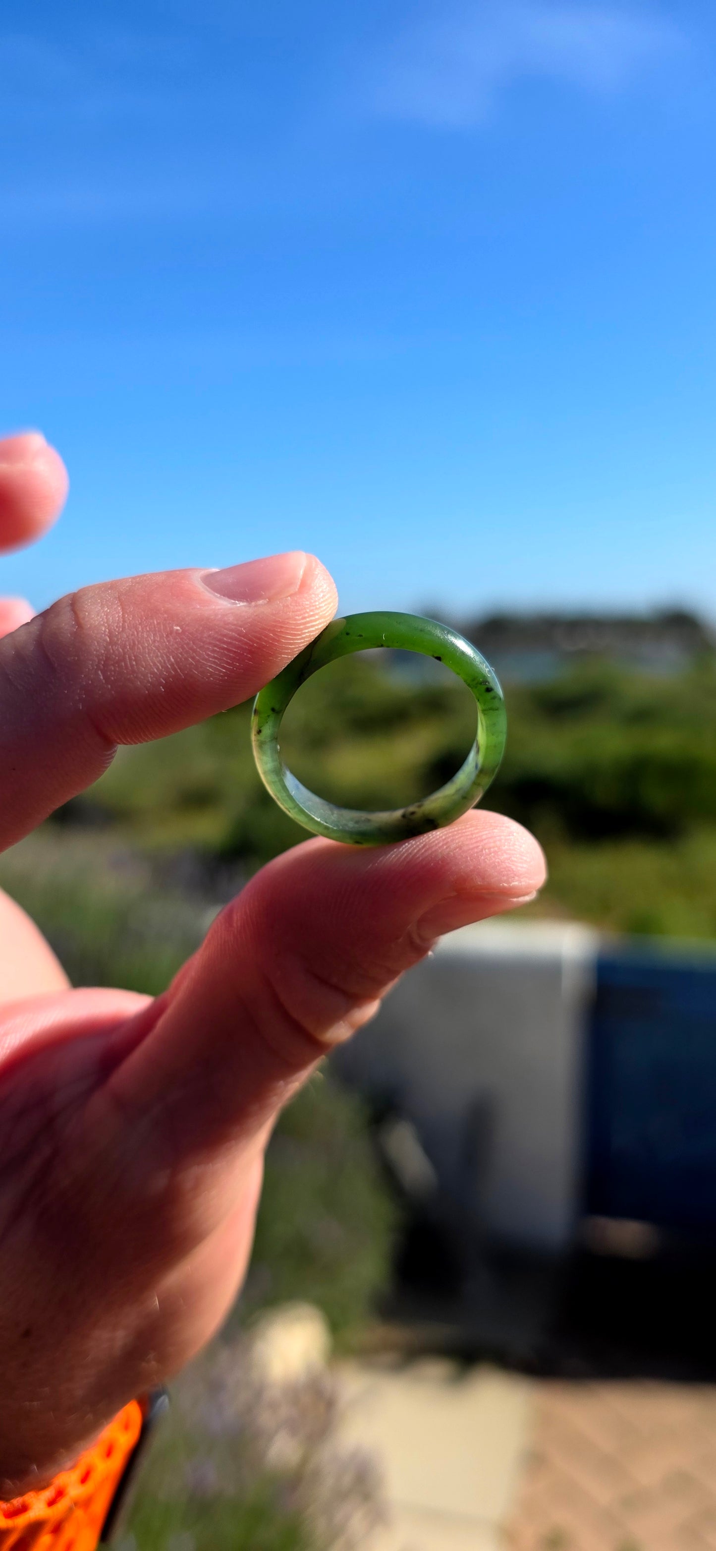 Simple, earthy and beautifully tactile, this solid nephrite jade ring has been carved entirely from a single piece of jade, creating a wonderfully smooth continuous band with no metal setting or embellishment to distract from the jade itself.