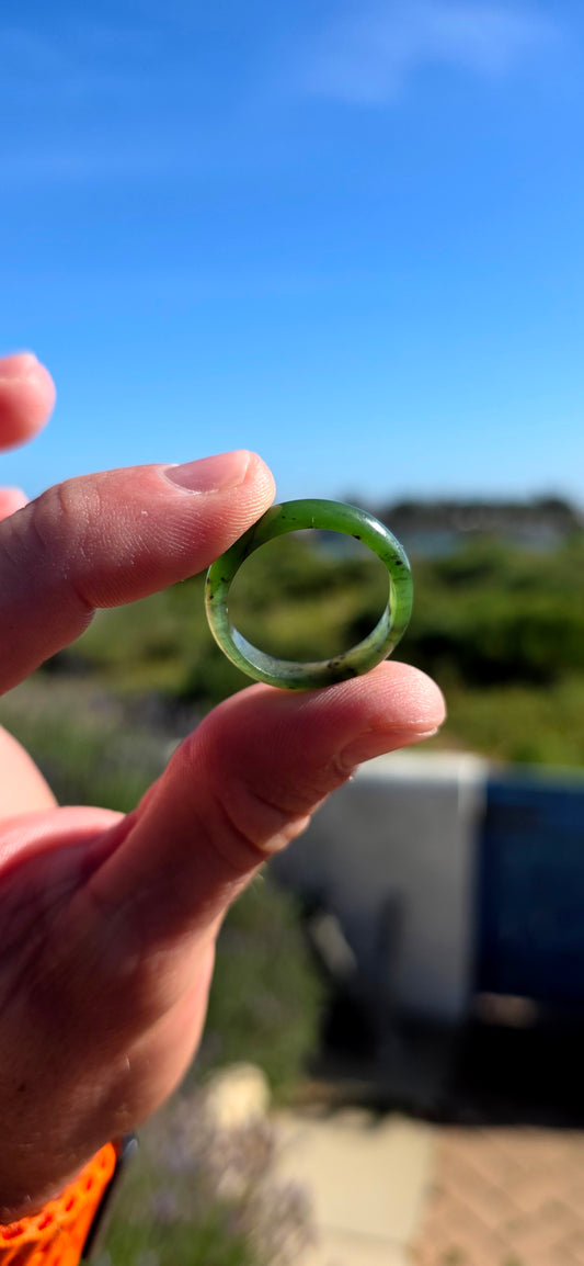 Simple, earthy and beautifully tactile, this solid nephrite jade ring has been carved entirely from a single piece of jade, creating a wonderfully smooth continuous band with no metal setting or embellishment to distract from the jade itself.