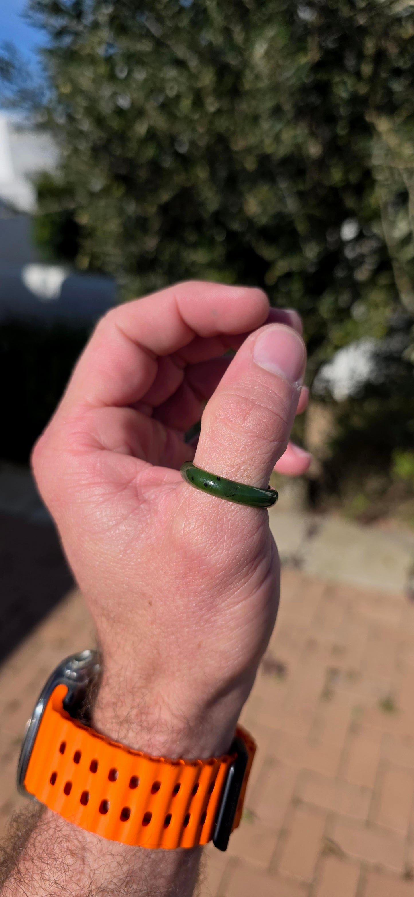Simple, earthy and beautifully tactile, this solid nephrite jade ring has been carved entirely from a single piece of jade, creating a wonderfully smooth continuous band with no metal setting or embellishment to distract from the jade itself.