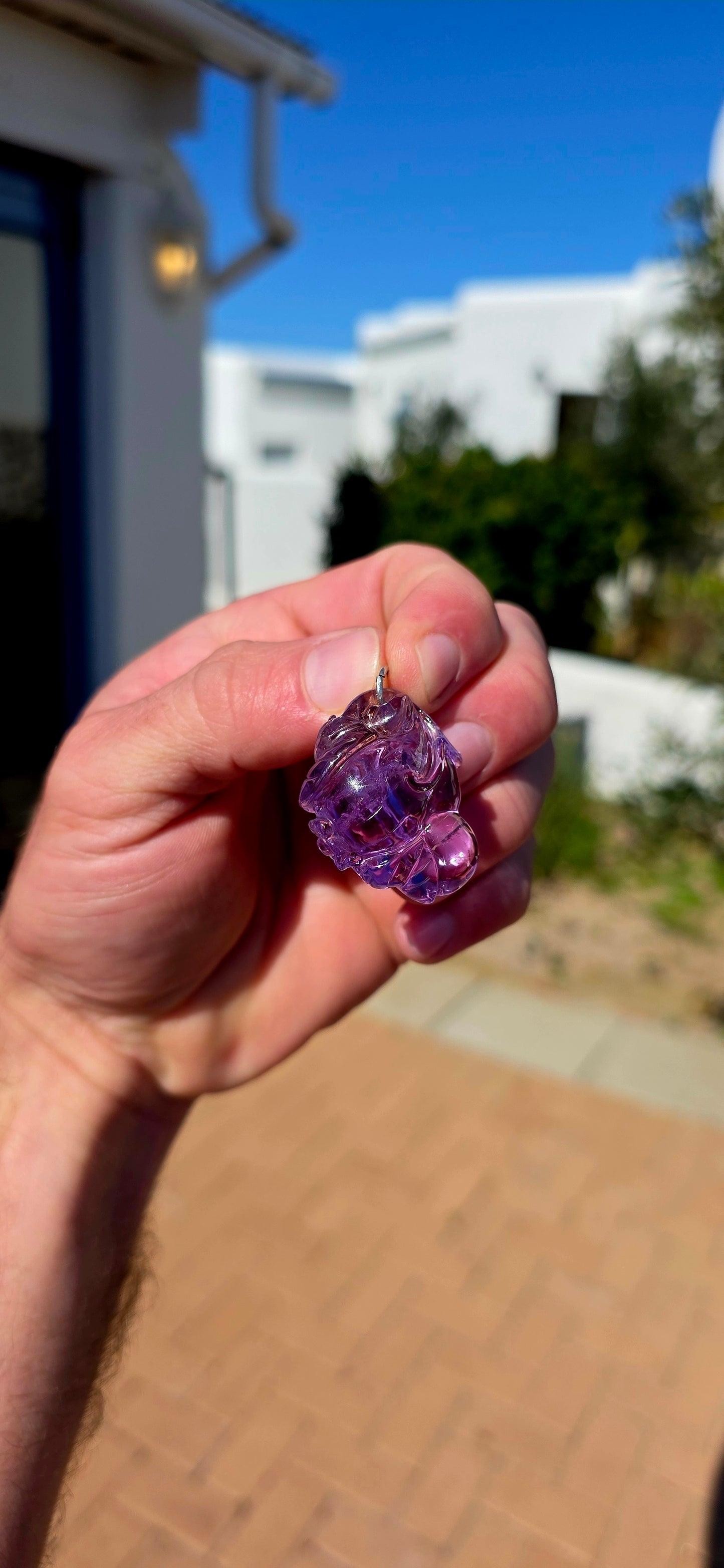 A wonderfully detailed vintage Chinese pendant, hand-carved from natural pale lavender amethyst with gorgeous translucency that really allows the intricate carving to come alive in the light.