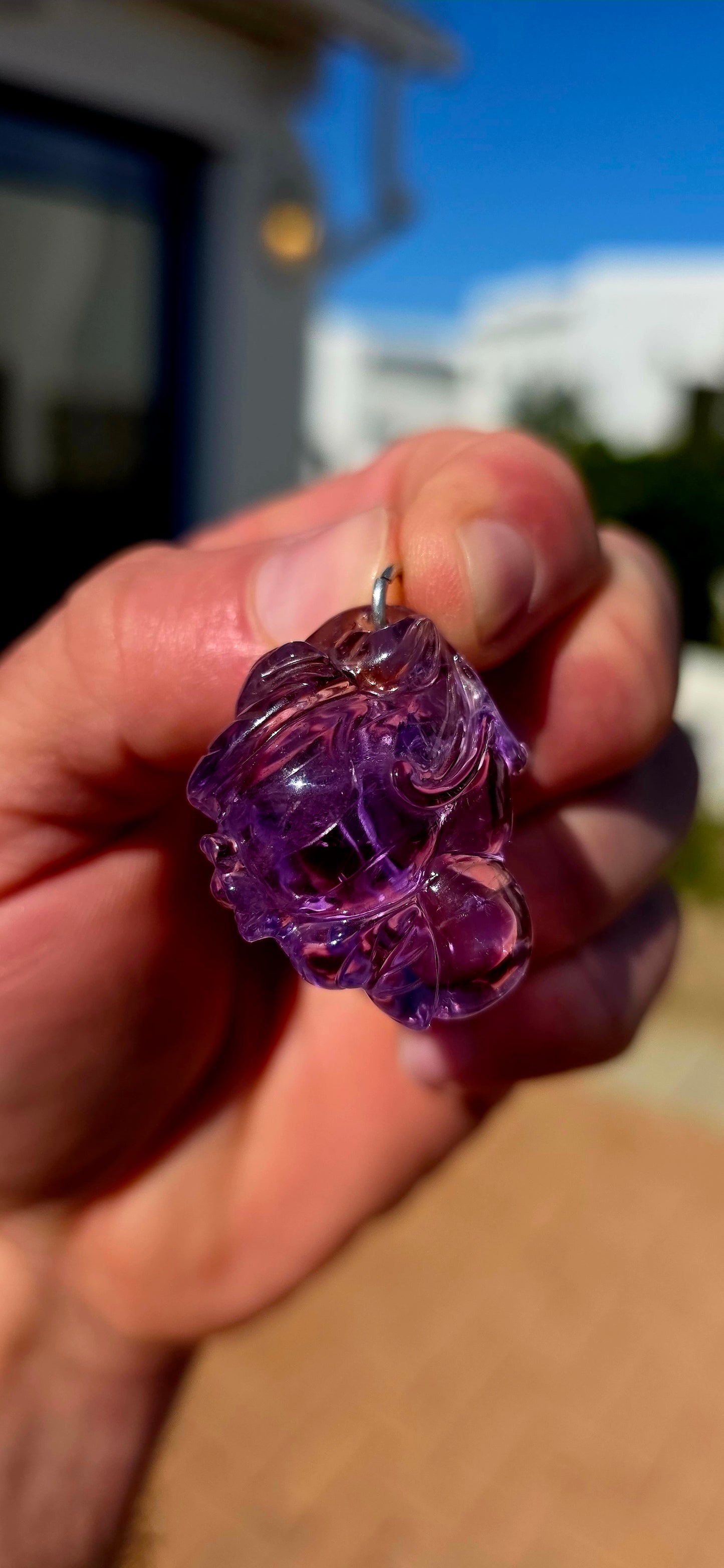 A wonderfully detailed vintage Chinese pendant, hand-carved from natural pale lavender amethyst with gorgeous translucency that really allows the intricate carving to come alive in the light.