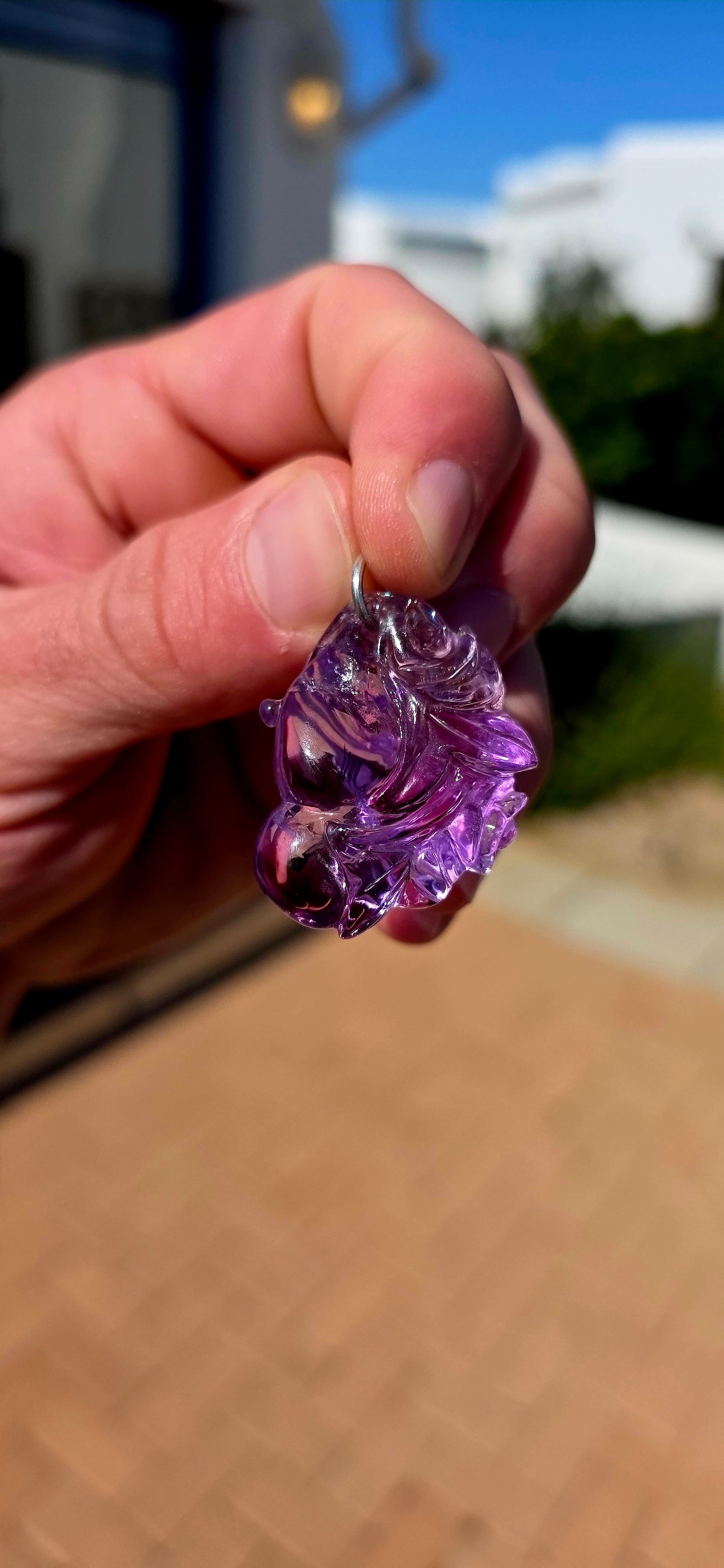 A wonderfully detailed vintage Chinese pendant, hand-carved from natural pale lavender amethyst with gorgeous translucency that really allows the intricate carving to come alive in the light.