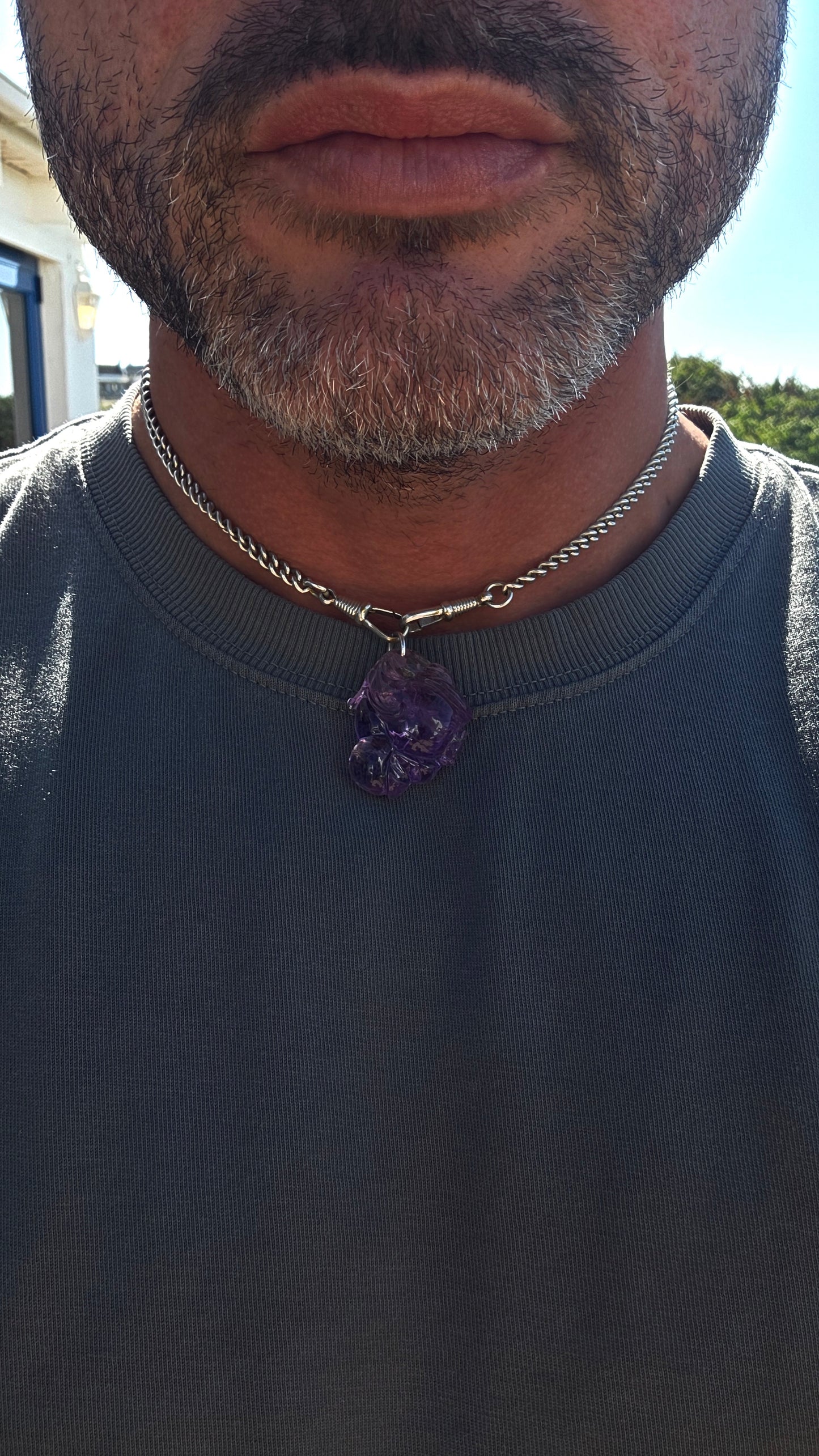 A wonderfully detailed vintage Chinese pendant, hand-carved from natural pale lavender amethyst with gorgeous translucency that really allows the intricate carving to come alive in the light.