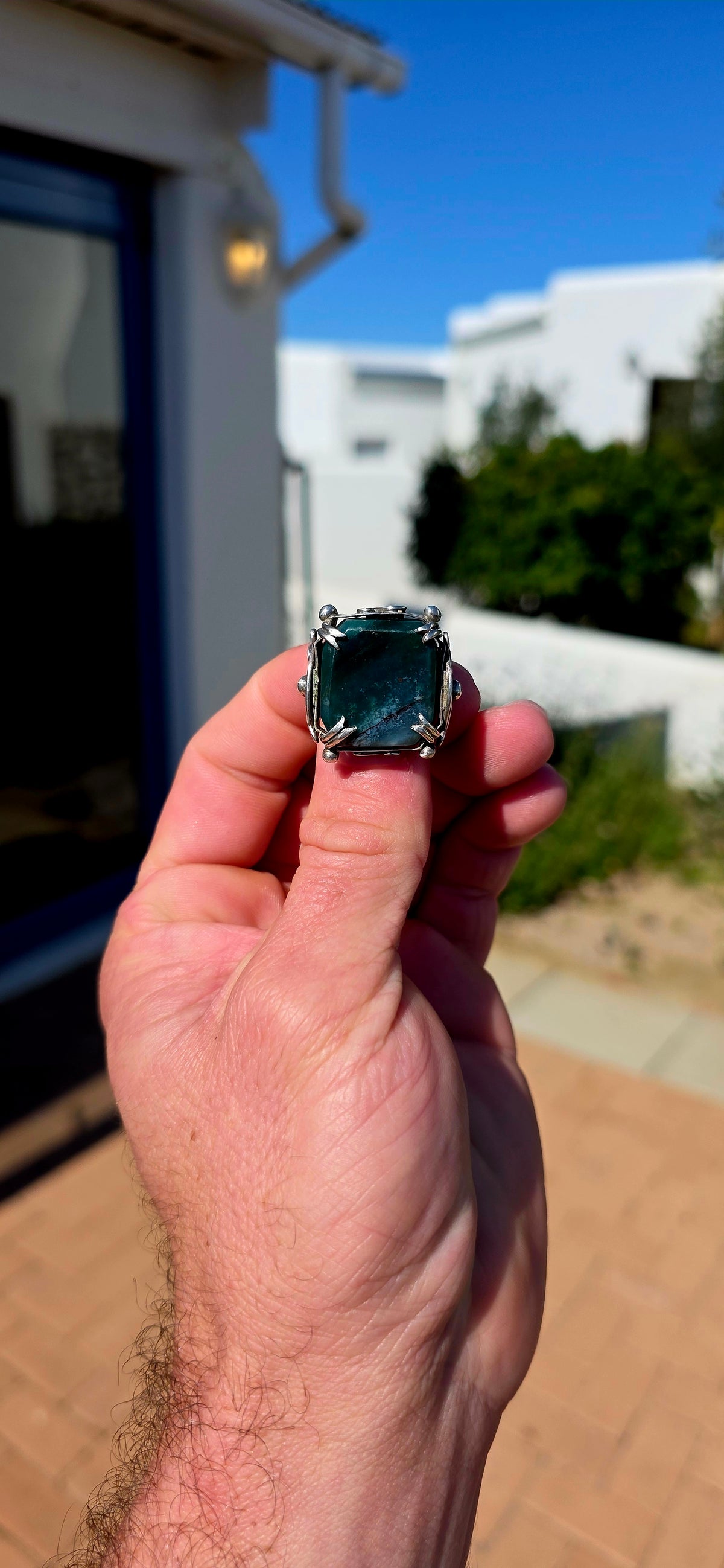 Dating to the Edwardian era, circa 1900–1910, this beautifully handcrafted brooch is fashioned in sterling silver and centres around a generously sized rectangular natural bloodstone agate cabochon.