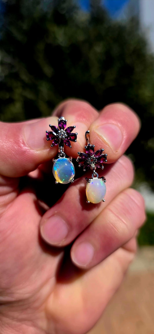 These are absolute STUNNERS!! A gorgeous pair of sterling silver drop earrings combining rich jewel-toned rhodolite garnets with generously sized, luminous opal cabochons.