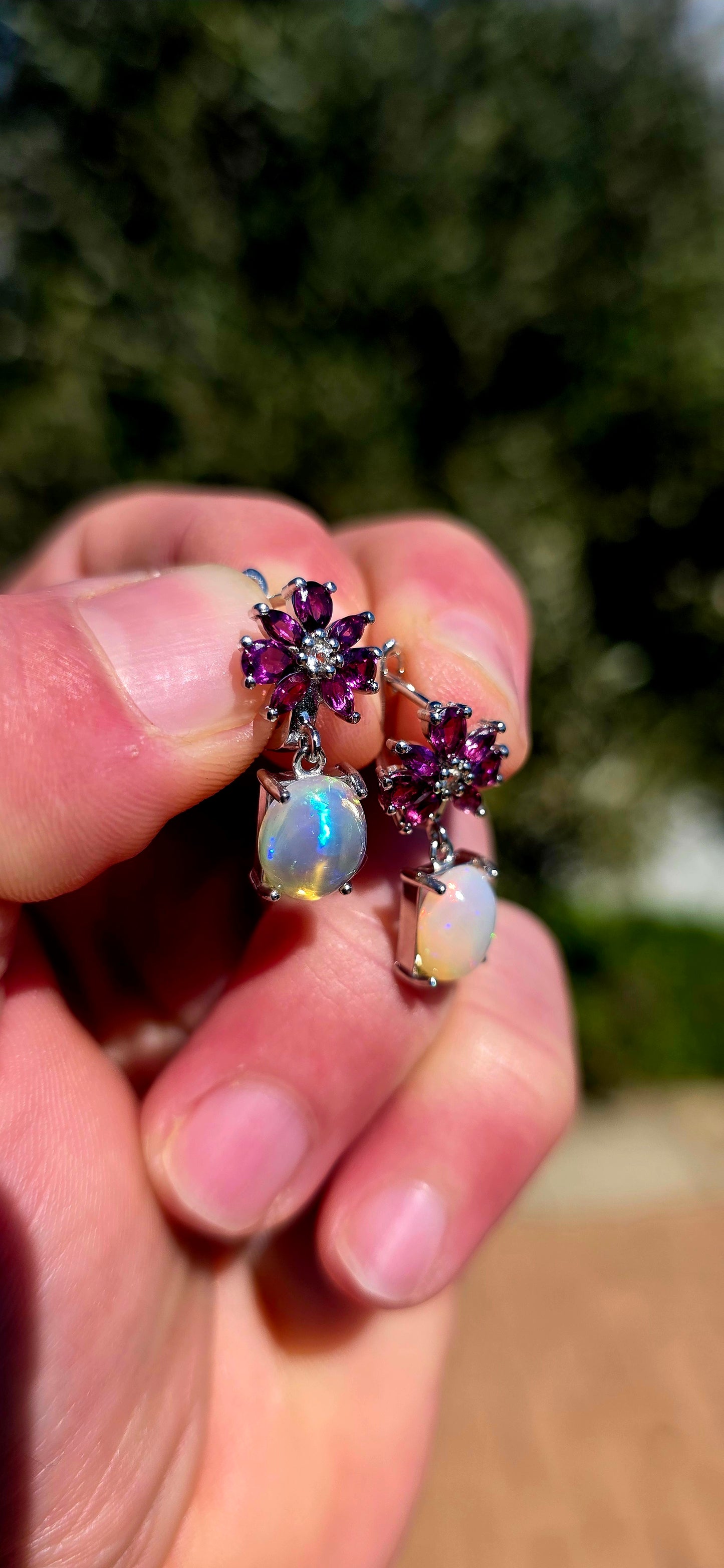 These are absolute STUNNERS!! A gorgeous pair of sterling silver drop earrings combining rich jewel-toned rhodolite garnets with generously sized, luminous opal cabochons.