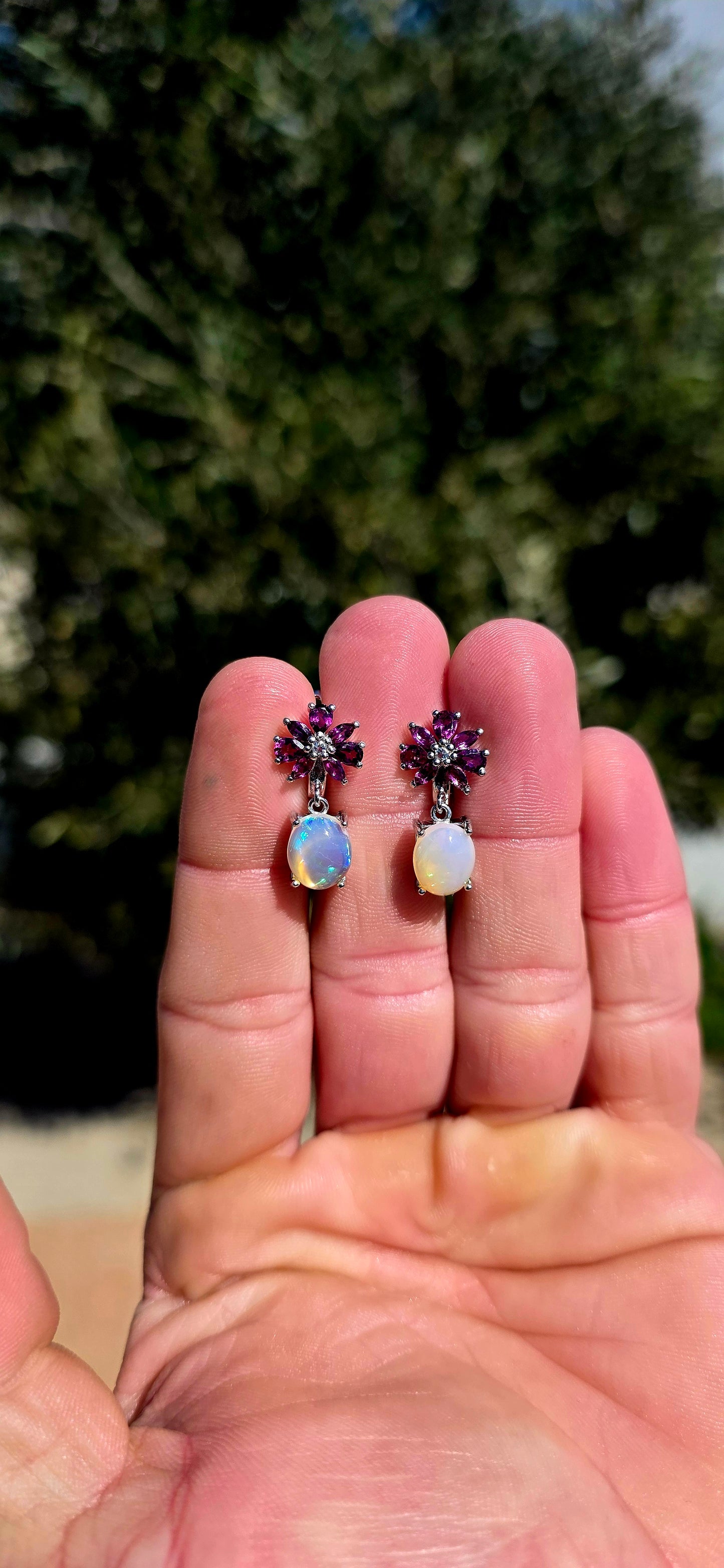 These are absolute STUNNERS!! A gorgeous pair of sterling silver drop earrings combining rich jewel-toned rhodolite garnets with generously sized, luminous opal cabochons.