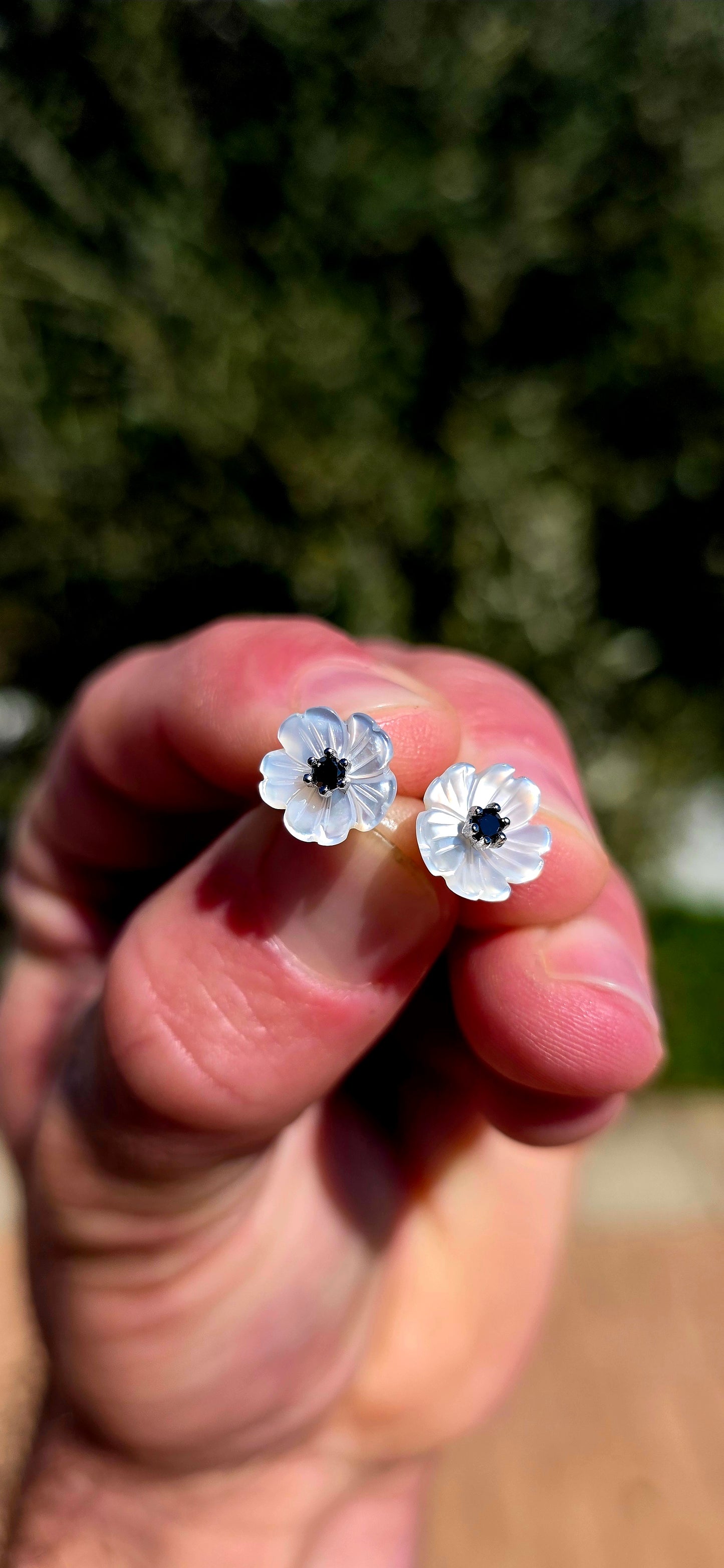Magical little beauties!! These gorgeous sterling silver flower stud earrings feature delicate blossoms individually carved from luminous mother-of-pearl, giving each petal beautiful natural iridescence and a wonderfully dimensional finish.