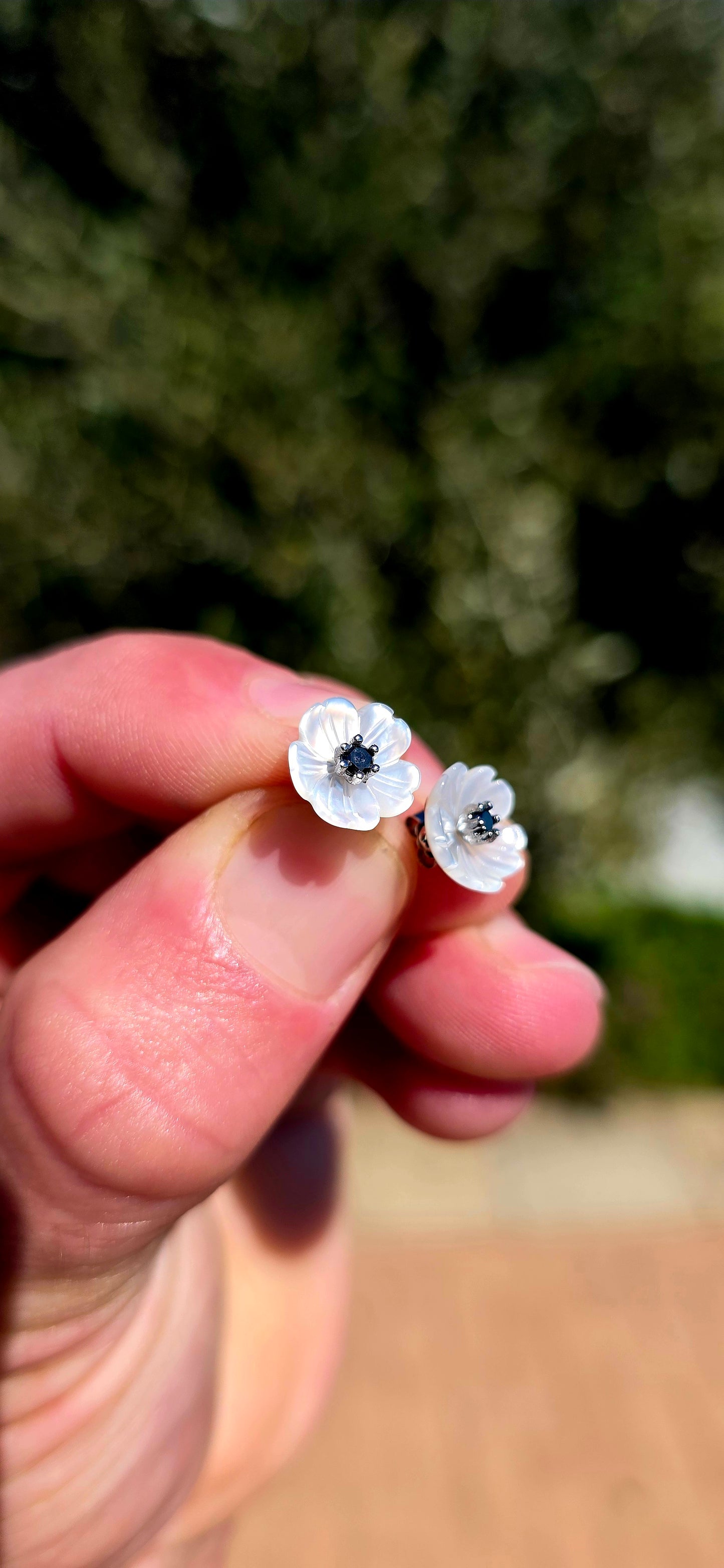 Magical little beauties!! These gorgeous sterling silver flower stud earrings feature delicate blossoms individually carved from luminous mother-of-pearl, giving each petal beautiful natural iridescence and a wonderfully dimensional finish.