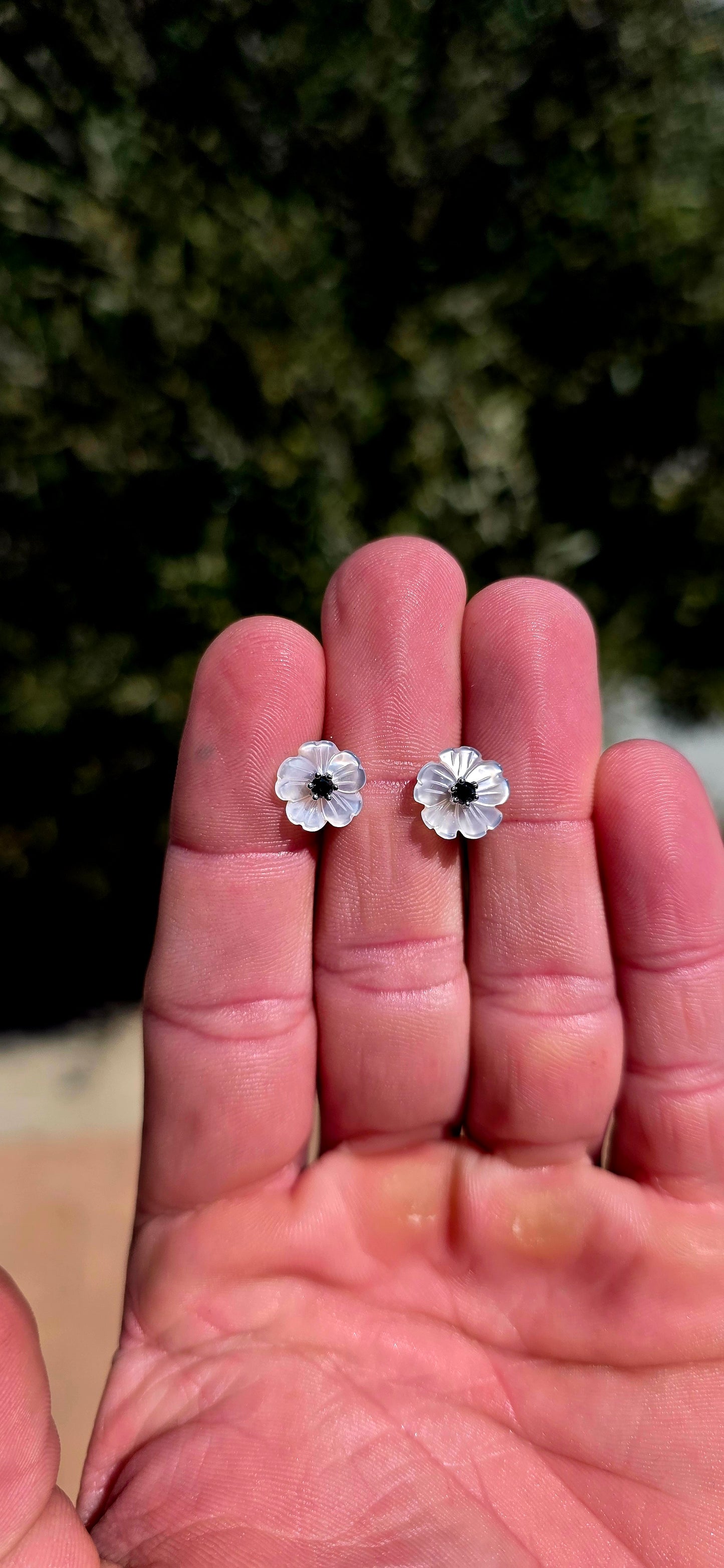 Magical little beauties!! These gorgeous sterling silver flower stud earrings feature delicate blossoms individually carved from luminous mother-of-pearl, giving each petal beautiful natural iridescence and a wonderfully dimensional finish.