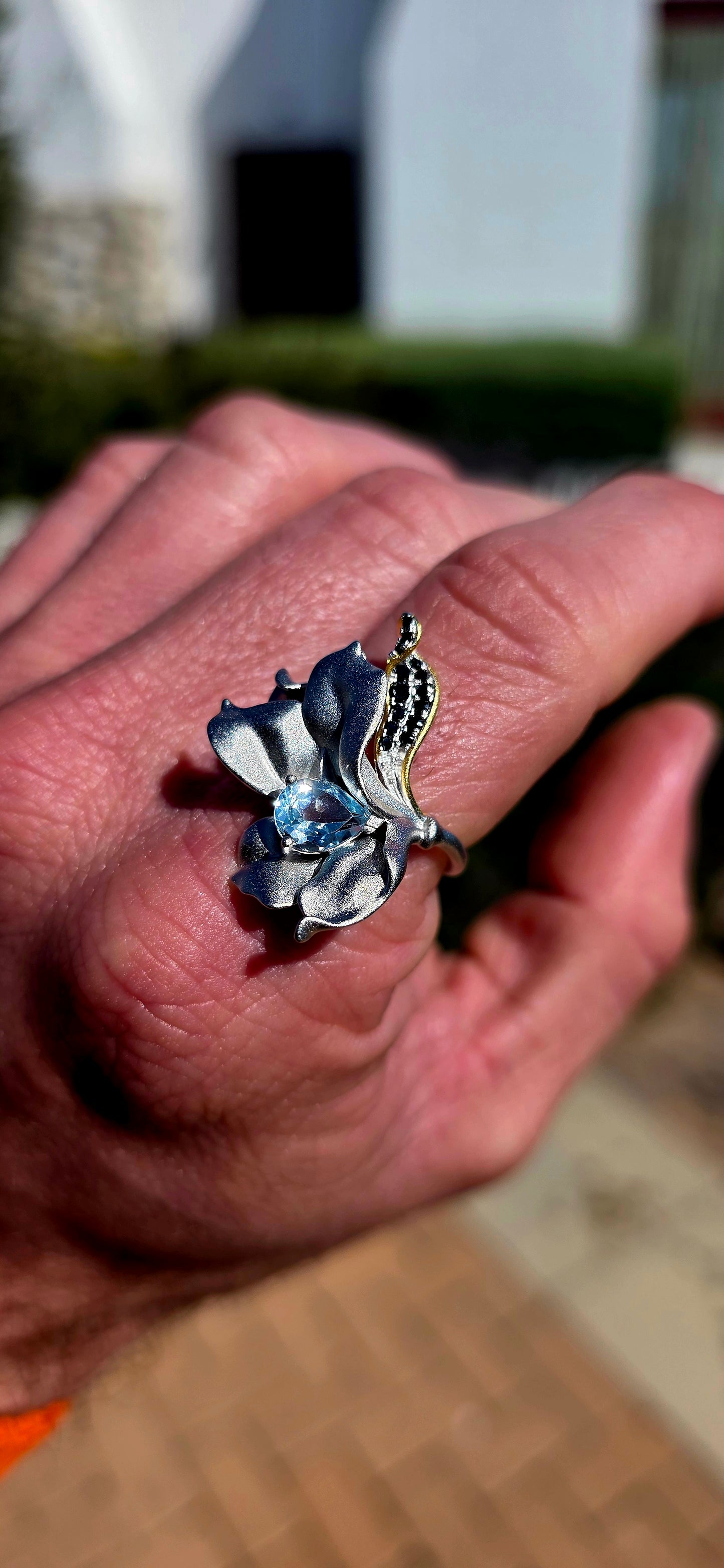 A ring fit for a Forest Queen!  This extraordinary artisan-made statement ring is crafted in sterling silver, sculpted into a wonderfully organic wildflower that appears almost as though it has just unfurled across the finger.