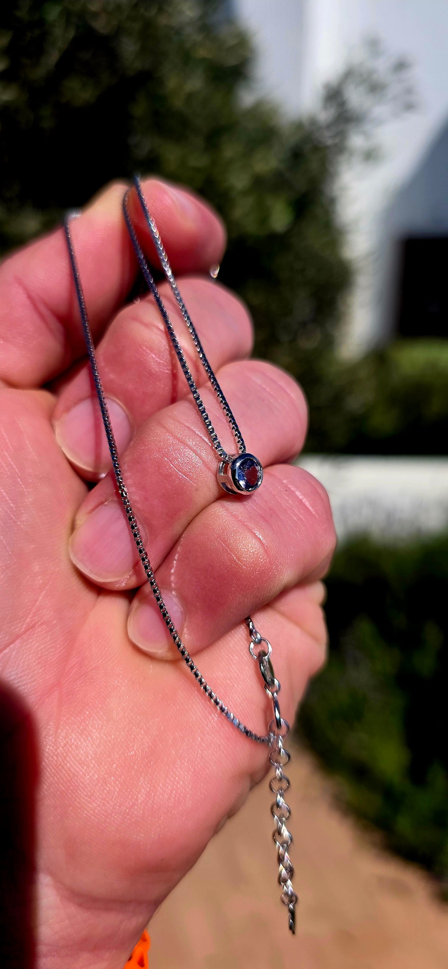 Minimalistic, timeless and beautifully UNISEX — this sterling silver necklace is proof that understated elegance never goes out of style.
Suspended from a fine sterling silver box-link chain is a single round-cut natural tanzanite.