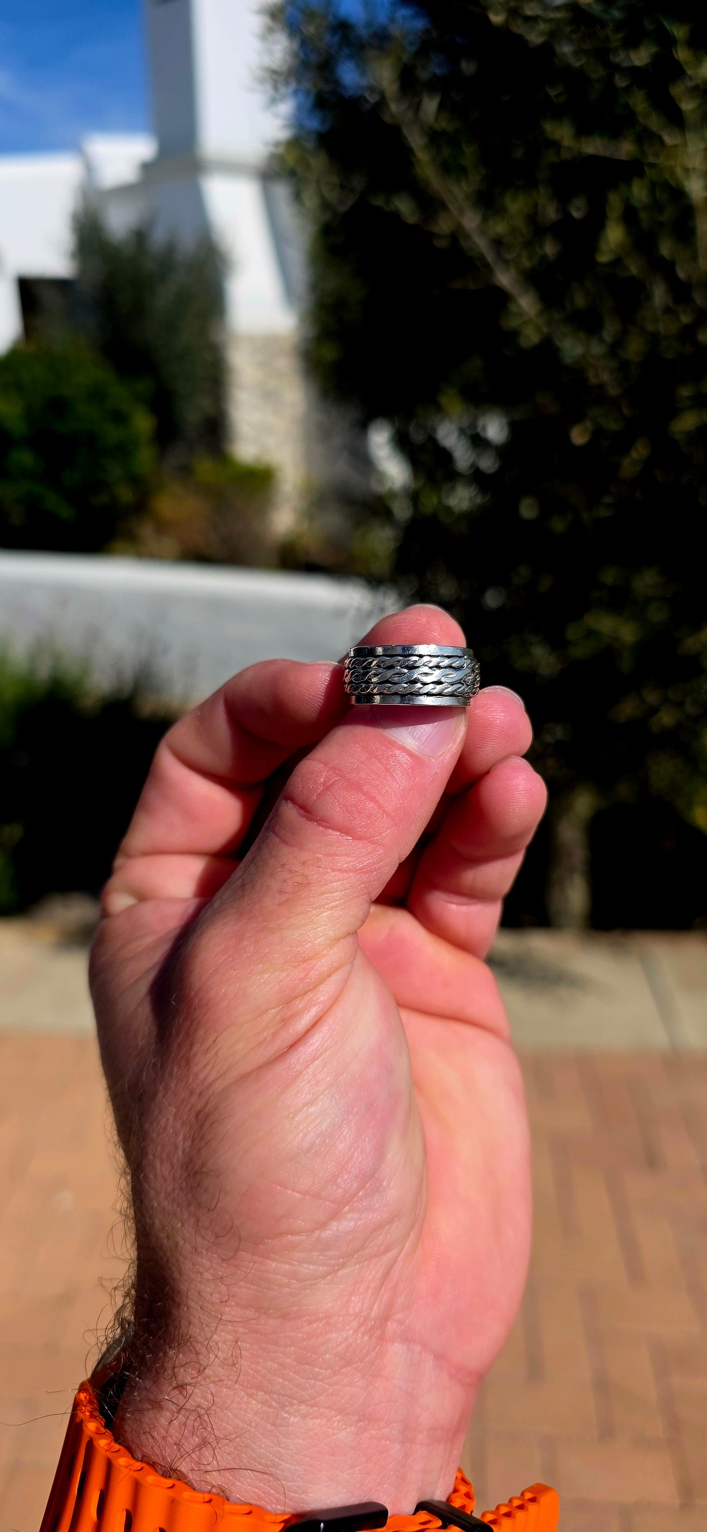 Fabulously tactile, chunky and beautifully UNISEX! This artisan-made spinner ring is crafted entirely in solid sterling silver, combining a substantial polished outer band with a wonderfully textured moving centre.