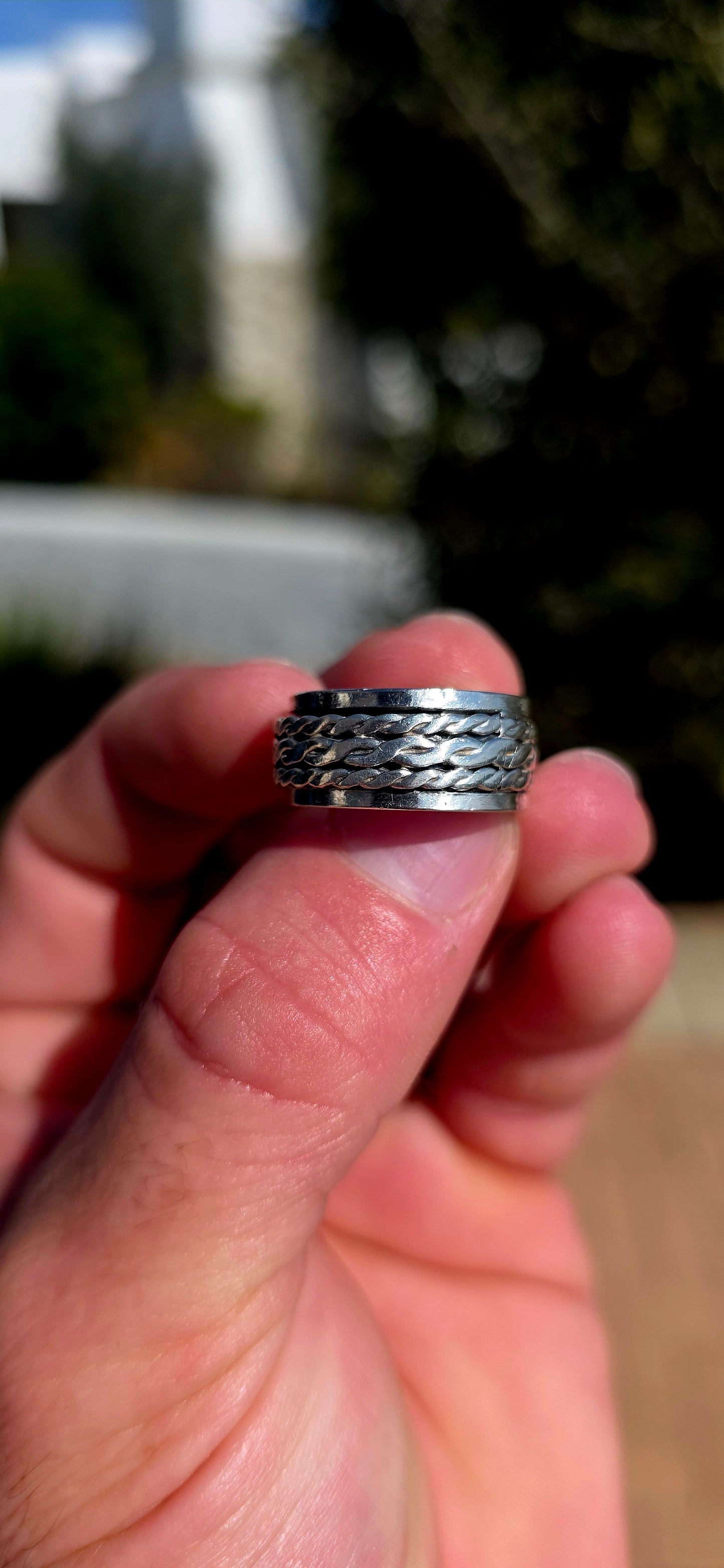 Fabulously tactile, chunky and beautifully UNISEX! This artisan-made spinner ring is crafted entirely in solid sterling silver, combining a substantial polished outer band with a wonderfully textured moving centre.