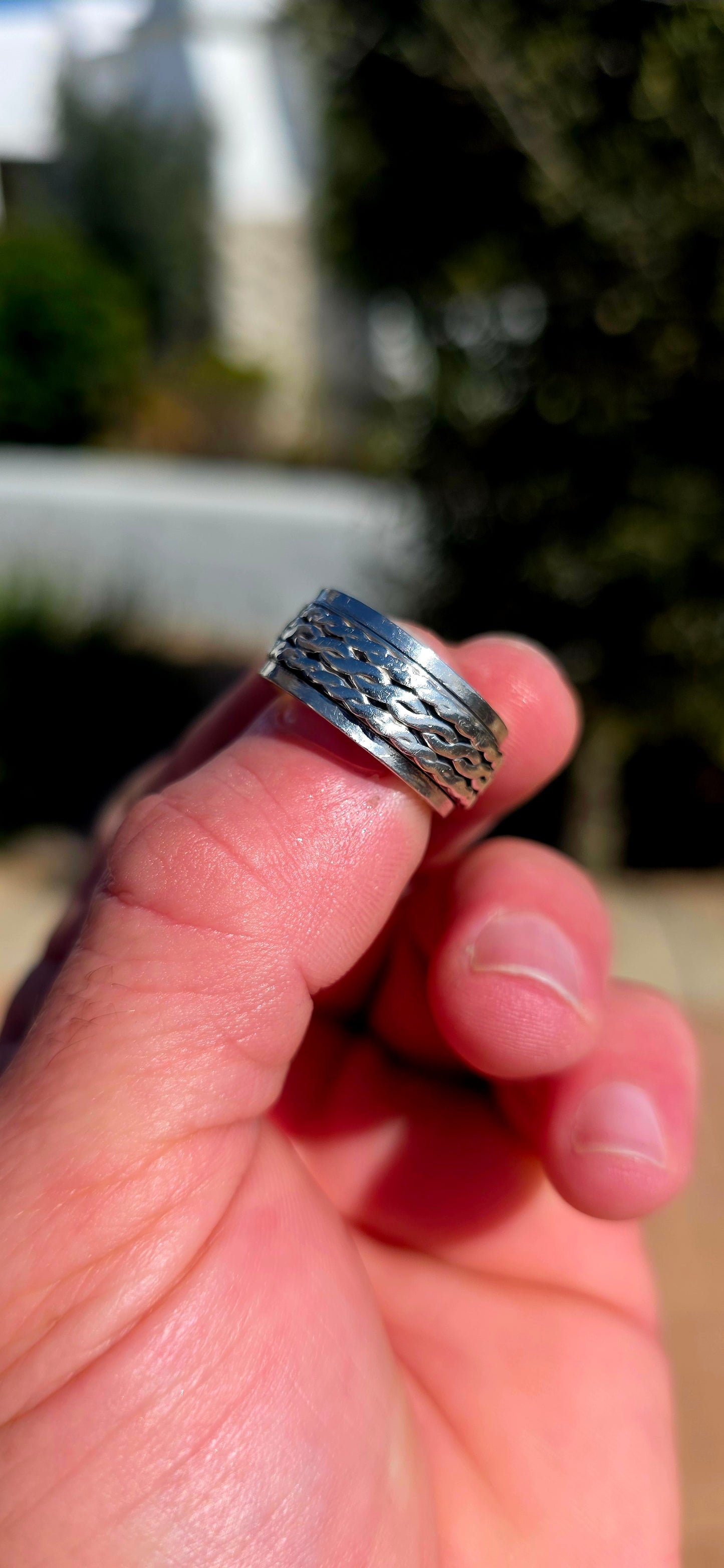 Fabulously tactile, chunky and beautifully UNISEX! This artisan-made spinner ring is crafted entirely in solid sterling silver, combining a substantial polished outer band with a wonderfully textured moving centre.